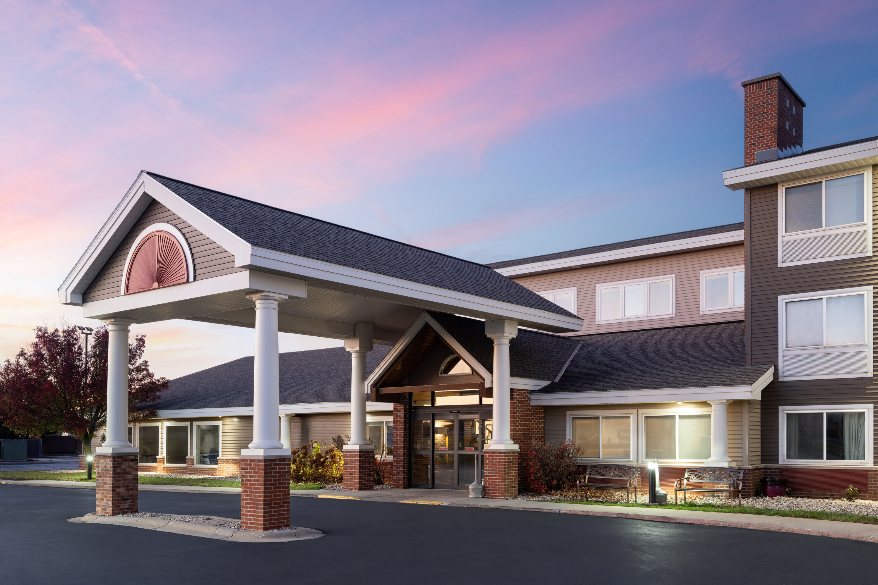 Exterior Dusk Image of AmericInn by Wyndham Beaver Dam hotel in Beaver Dam, Wisconsin