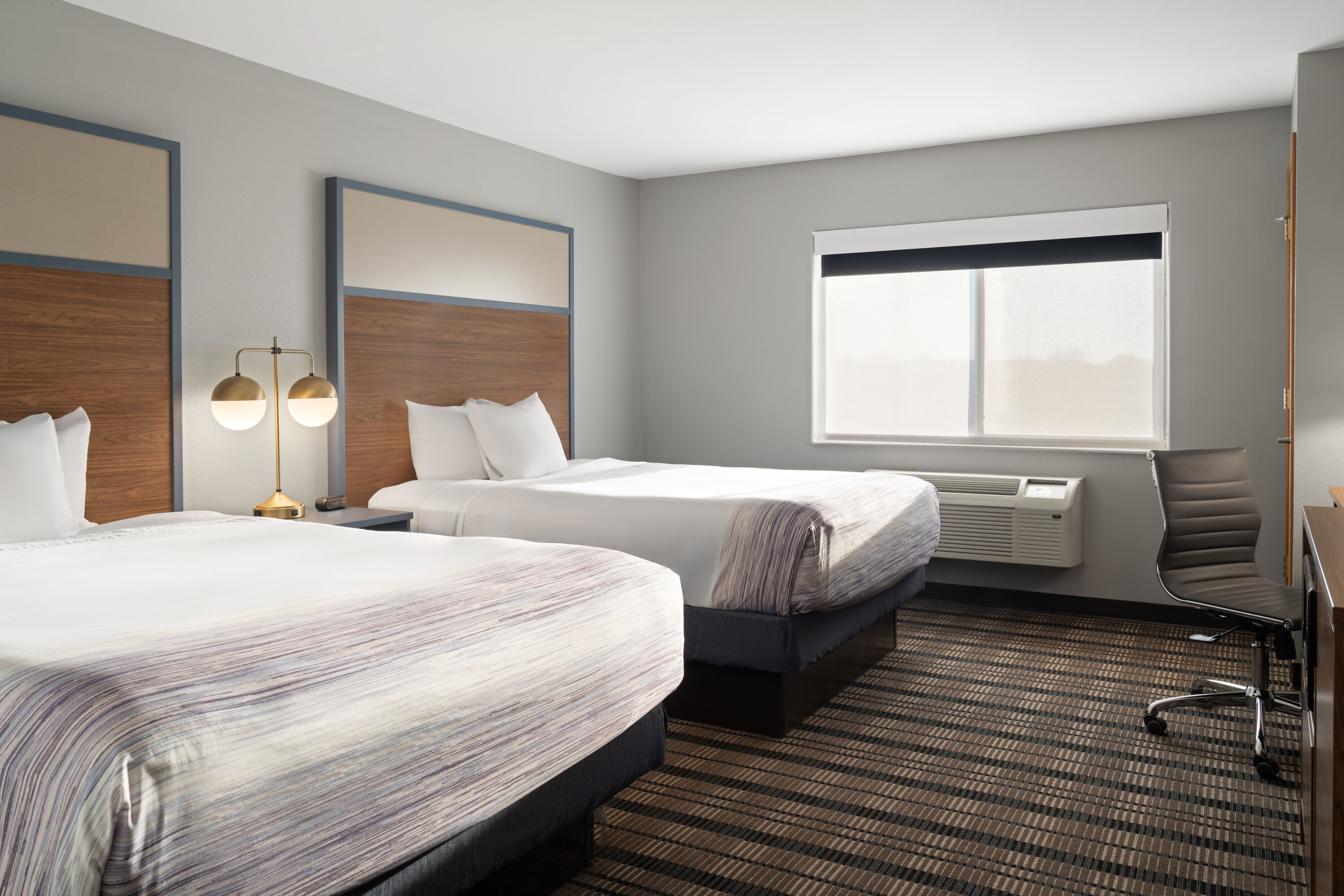 Guest room at the AmericInn by Wyndham Beaver Dam in Beaver Dam, Wisconsin