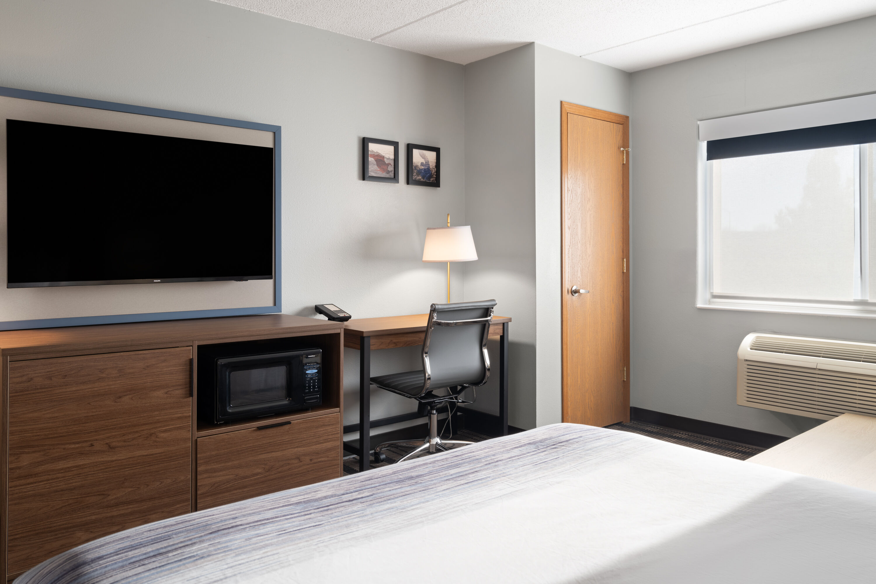 Guest room at the AmericInn by Wyndham Beaver Dam in Beaver Dam, Wisconsin