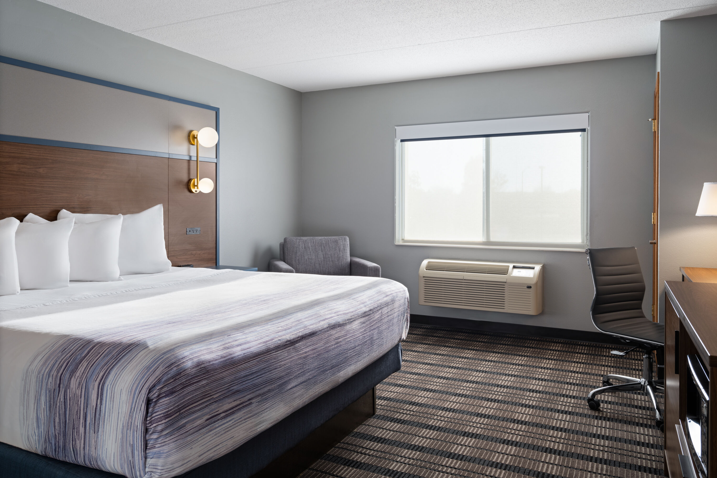 Guest room at the AmericInn by Wyndham Beaver Dam in Beaver Dam, Wisconsin