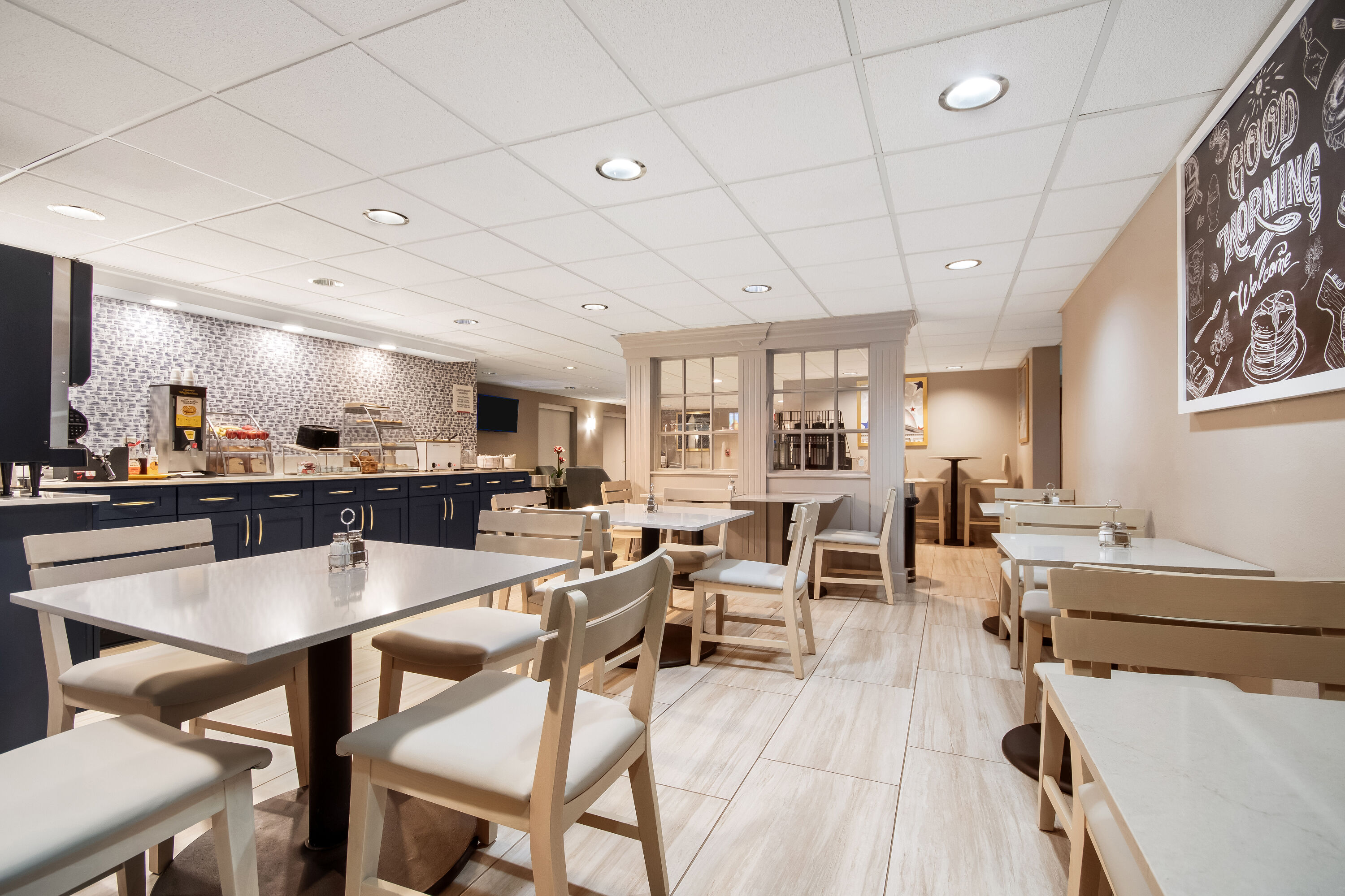 AmericInn by Wyndham Beloit restaurant breakfast area with seating in Beloit, Wisconsin