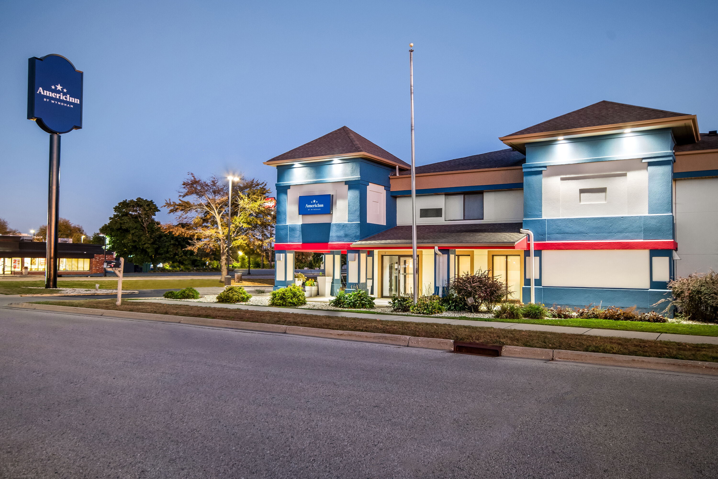Exterior Dusk Image of AmericInn by Wyndham Beloit hotel in Beloit, Wisconsin