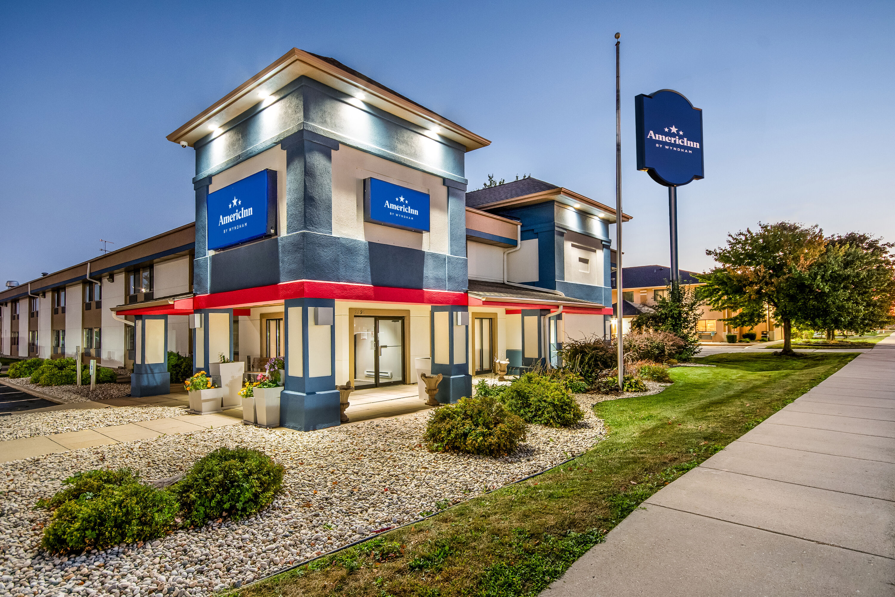 Exterior Dusk Image of AmericInn by Wyndham Beloit hotel in Beloit, Wisconsin