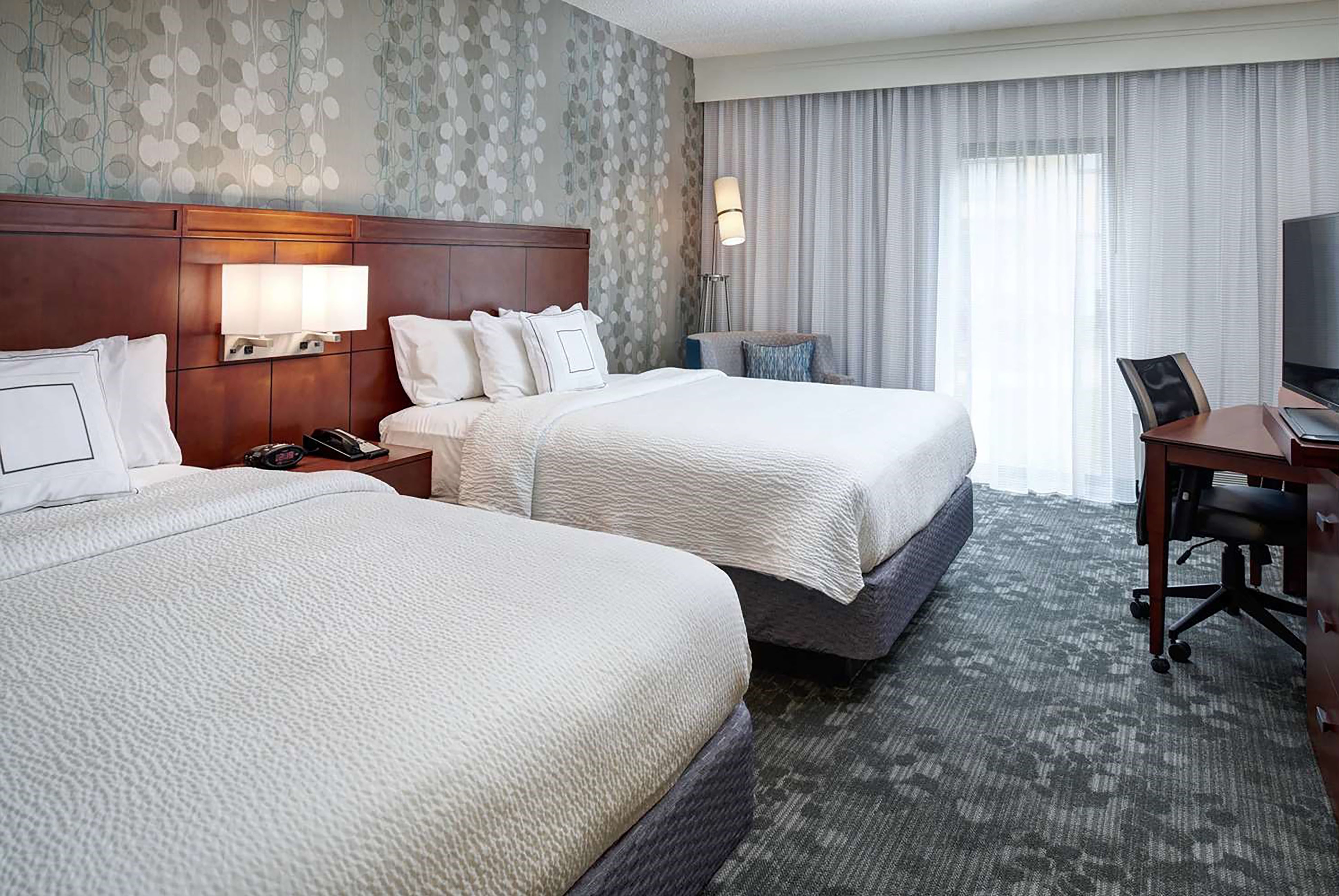 Guest room at the AmericInn by Wyndham Brookfield in Brookfield, Wisconsin