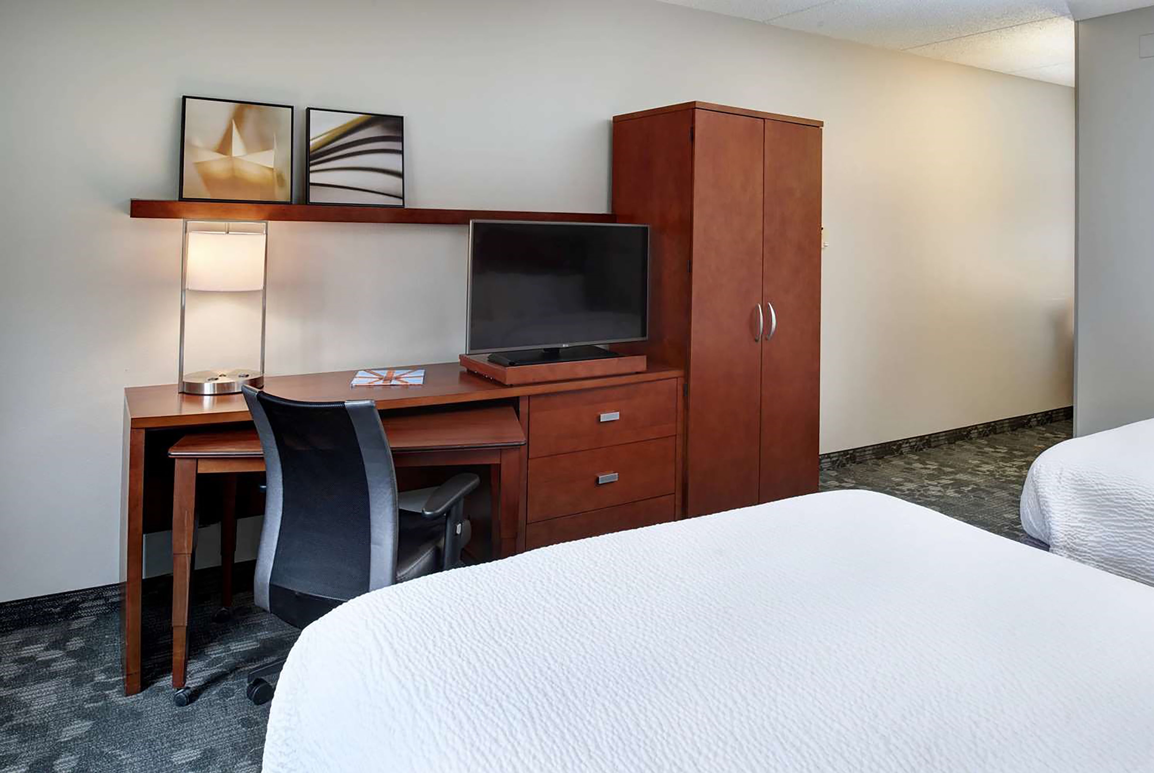Guest room at the AmericInn by Wyndham Brookfield in Brookfield, Wisconsin