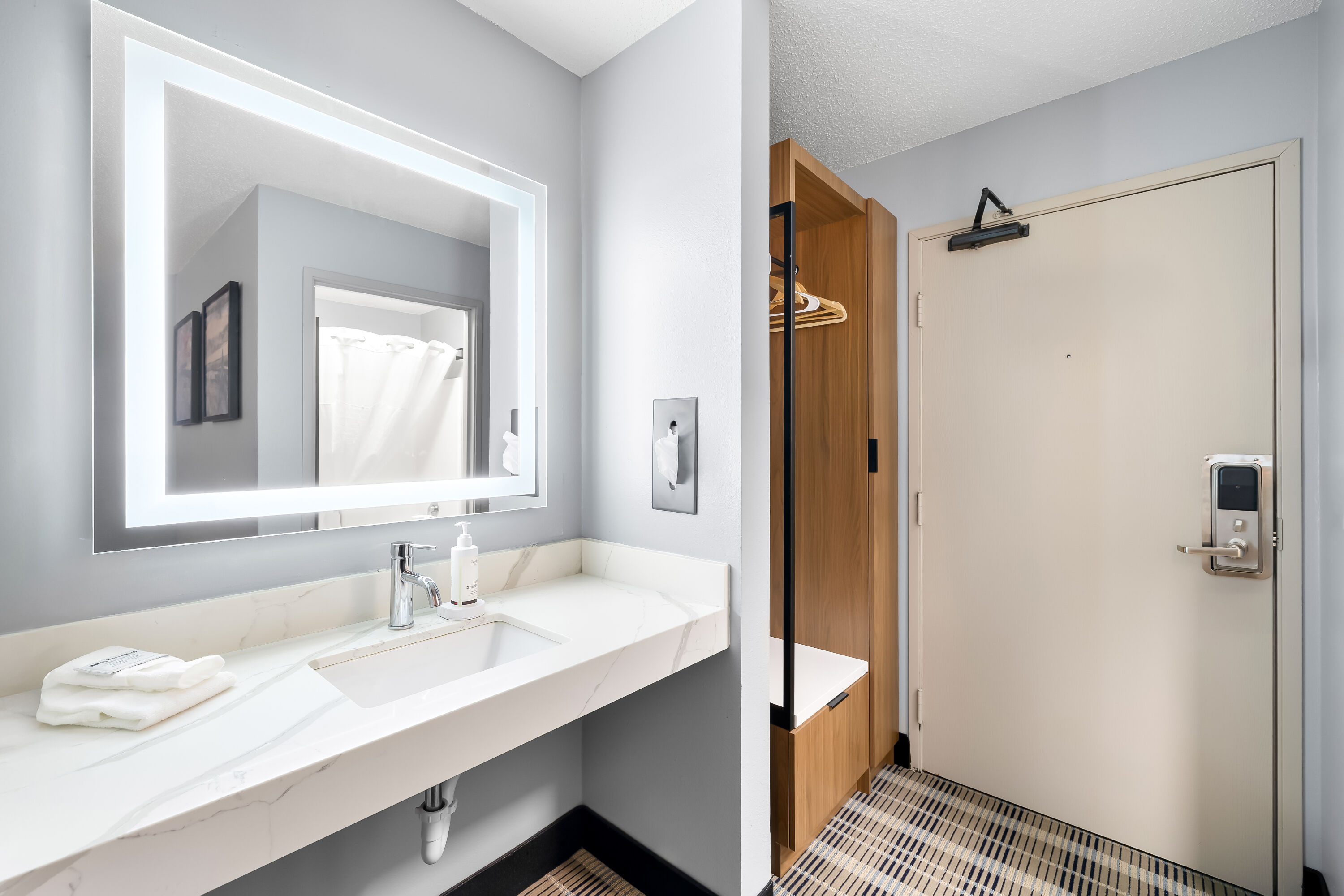 Guest room bath at the AmericInn by Wyndham Columbus Wisconsin in Columbus, Wisconsin