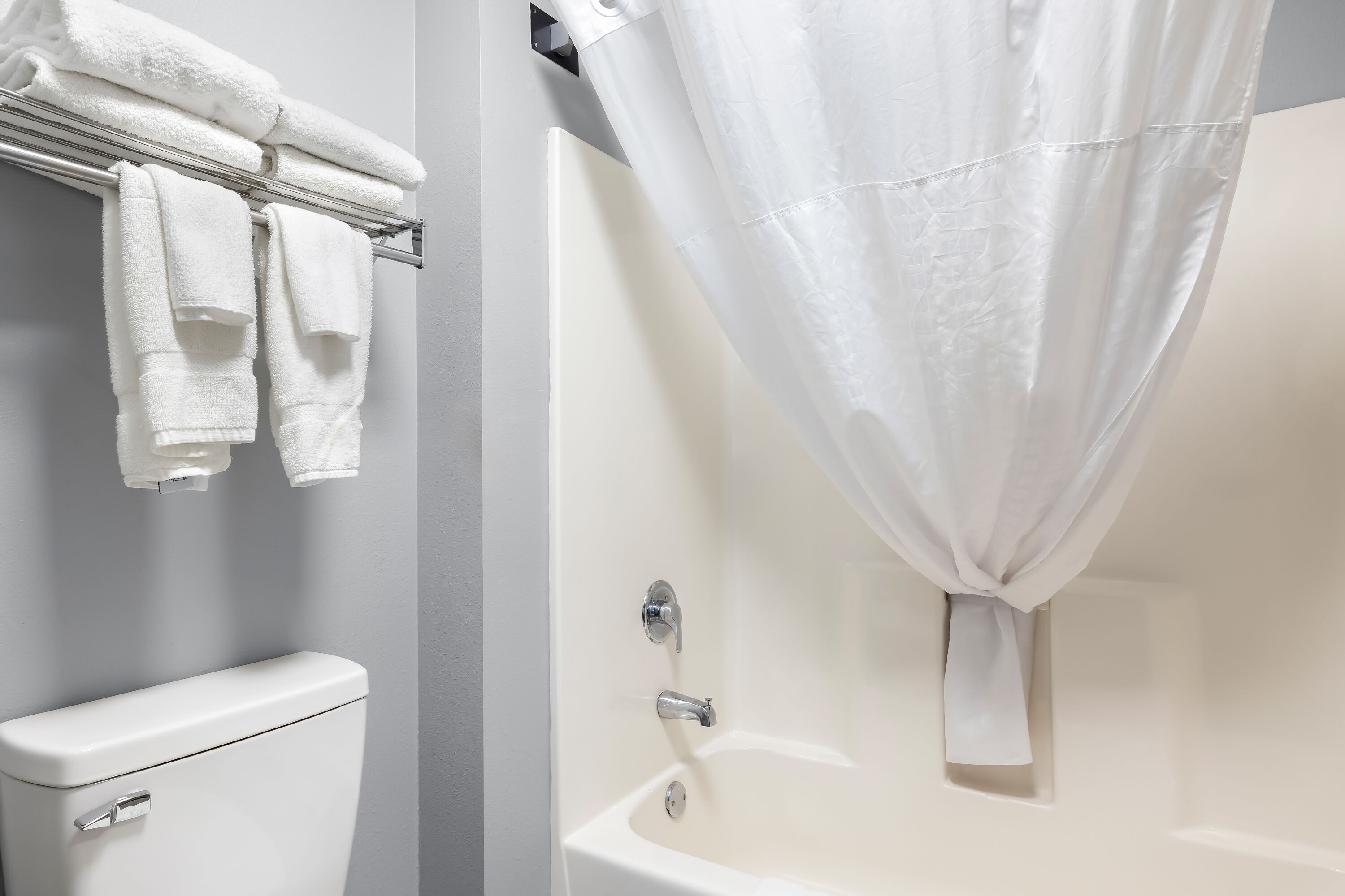 Guest room bath at the AmericInn by Wyndham Columbus Wisconsin in Columbus, Wisconsin