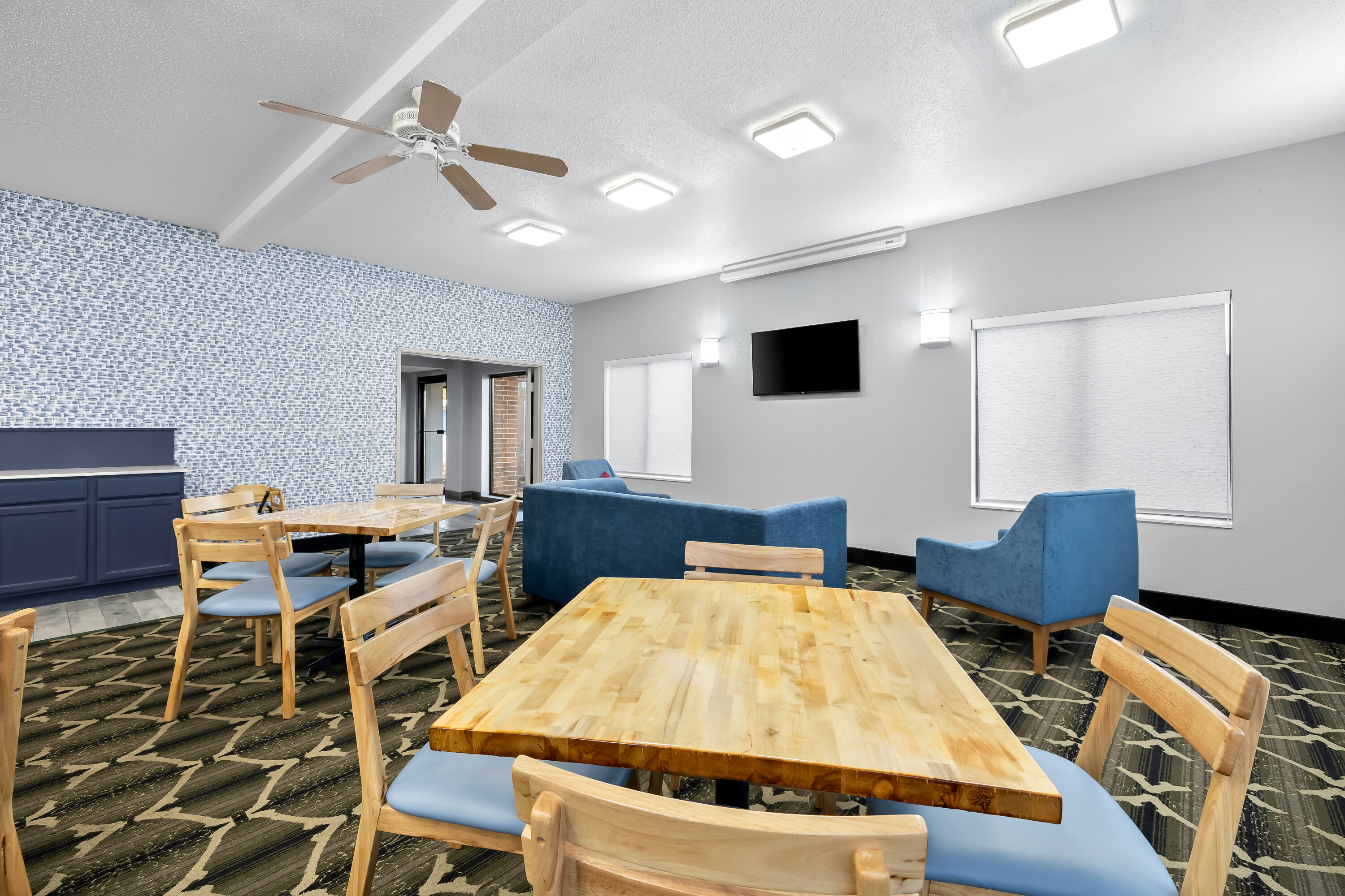 AmericInn by Wyndham Columbus Wisconsin restaurant breakfast area with seating in Columbus, Wisconsin