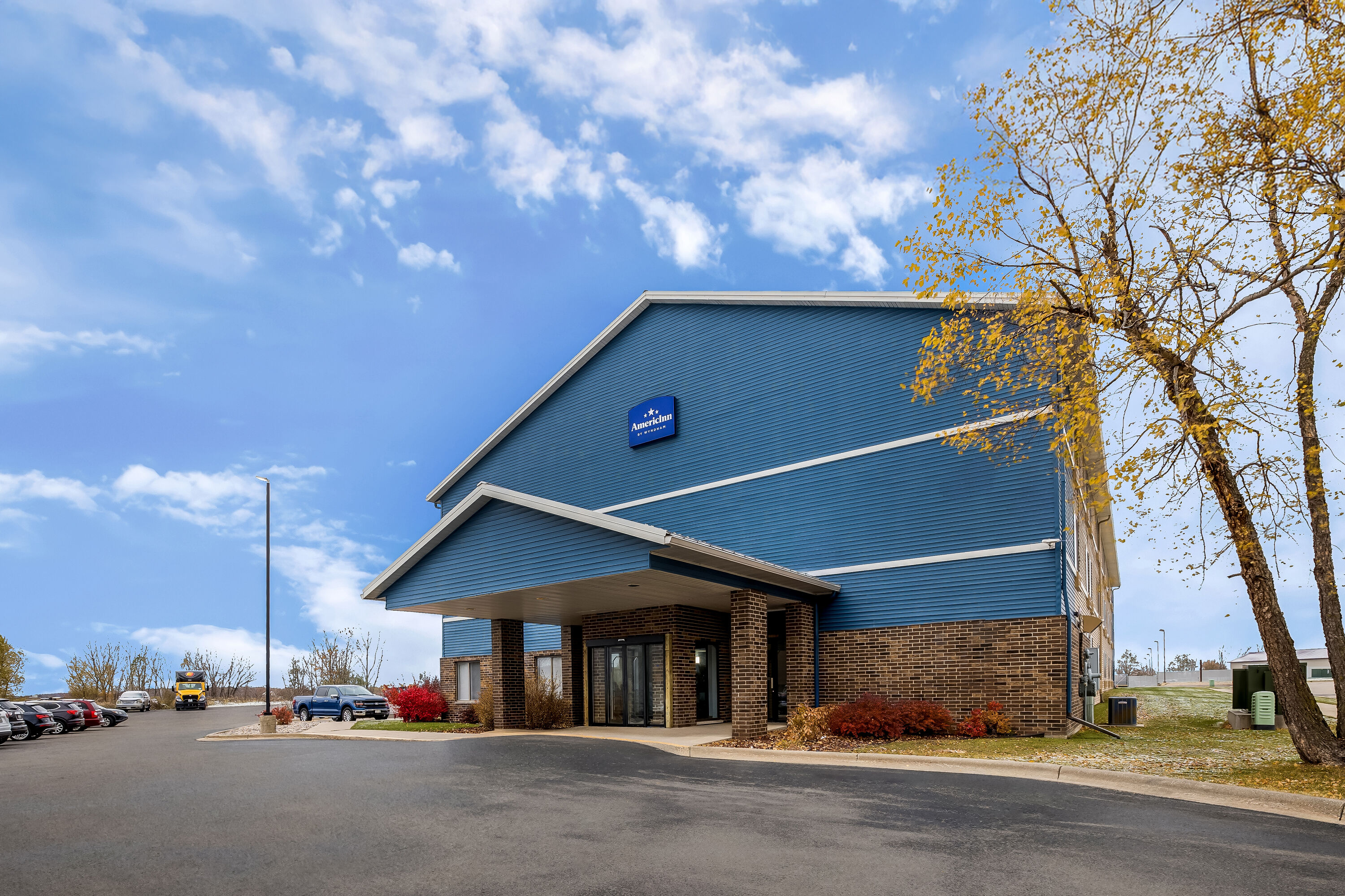Exterior Day Image of AmericInn by Wyndham Columbus Wisconsin hotel in Columbus, Wisconsin