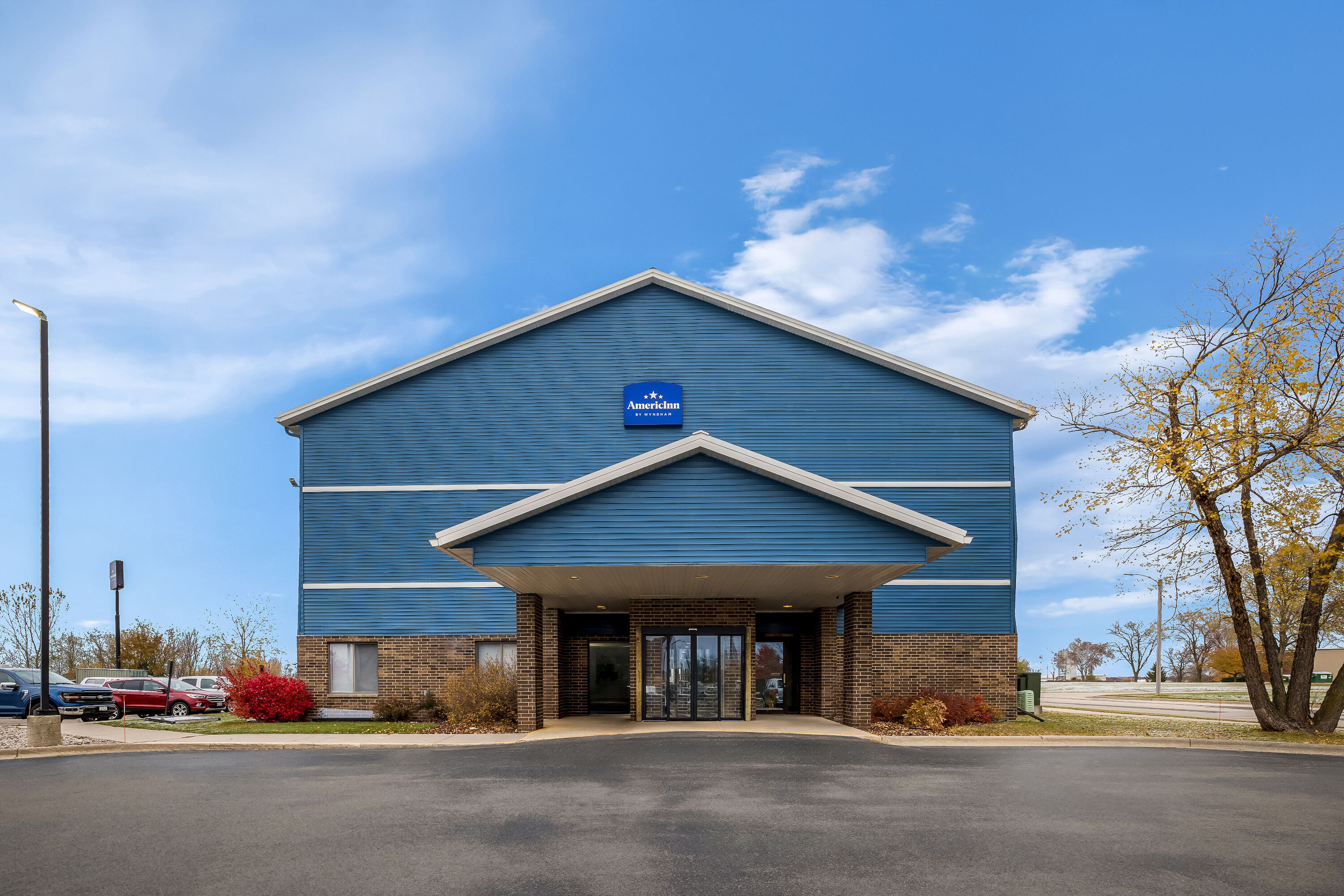 Exterior Day Image of AmericInn by Wyndham Columbus Wisconsin hotel in Columbus, Wisconsin