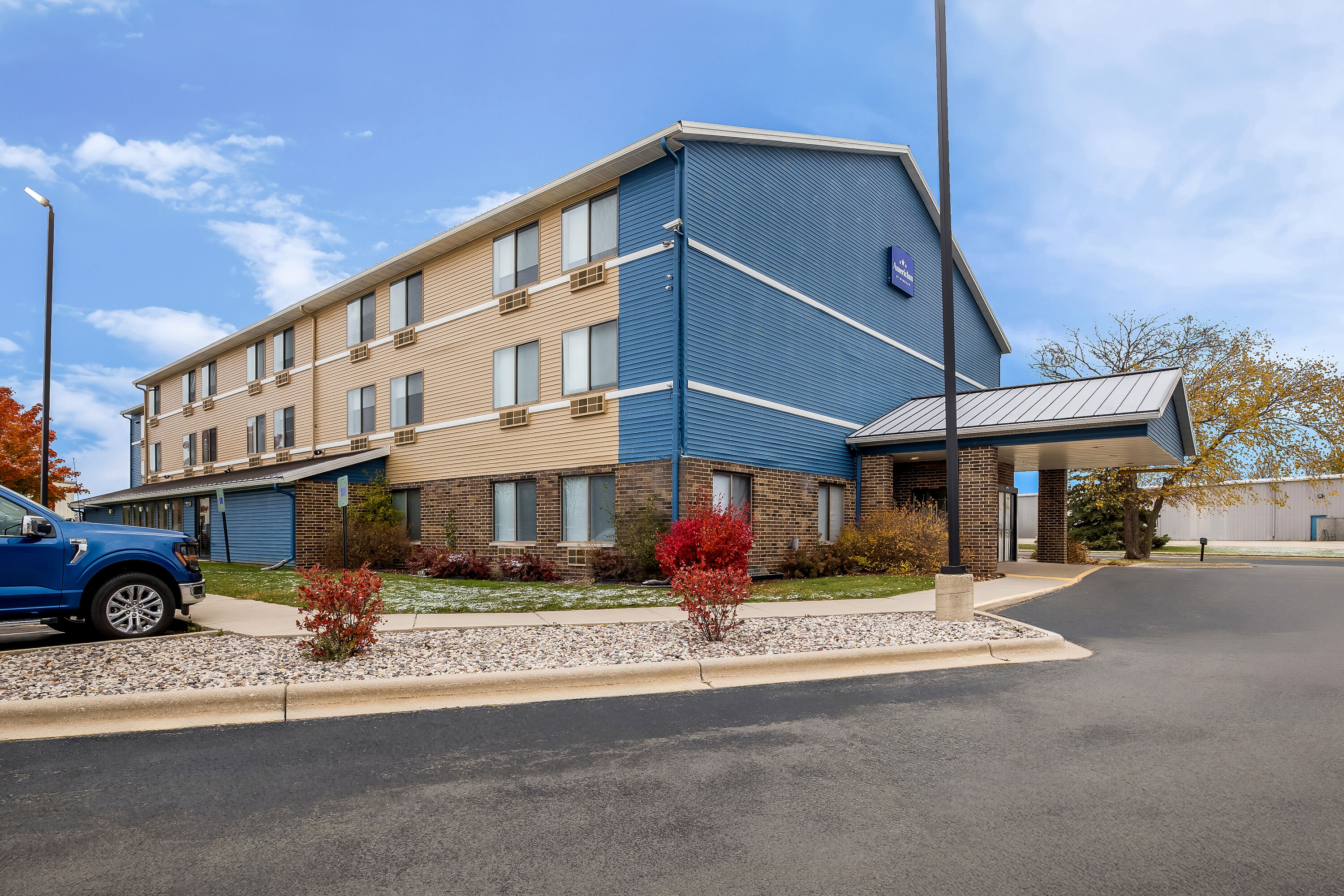 Exterior Day Image of AmericInn by Wyndham Columbus Wisconsin hotel in Columbus, Wisconsin