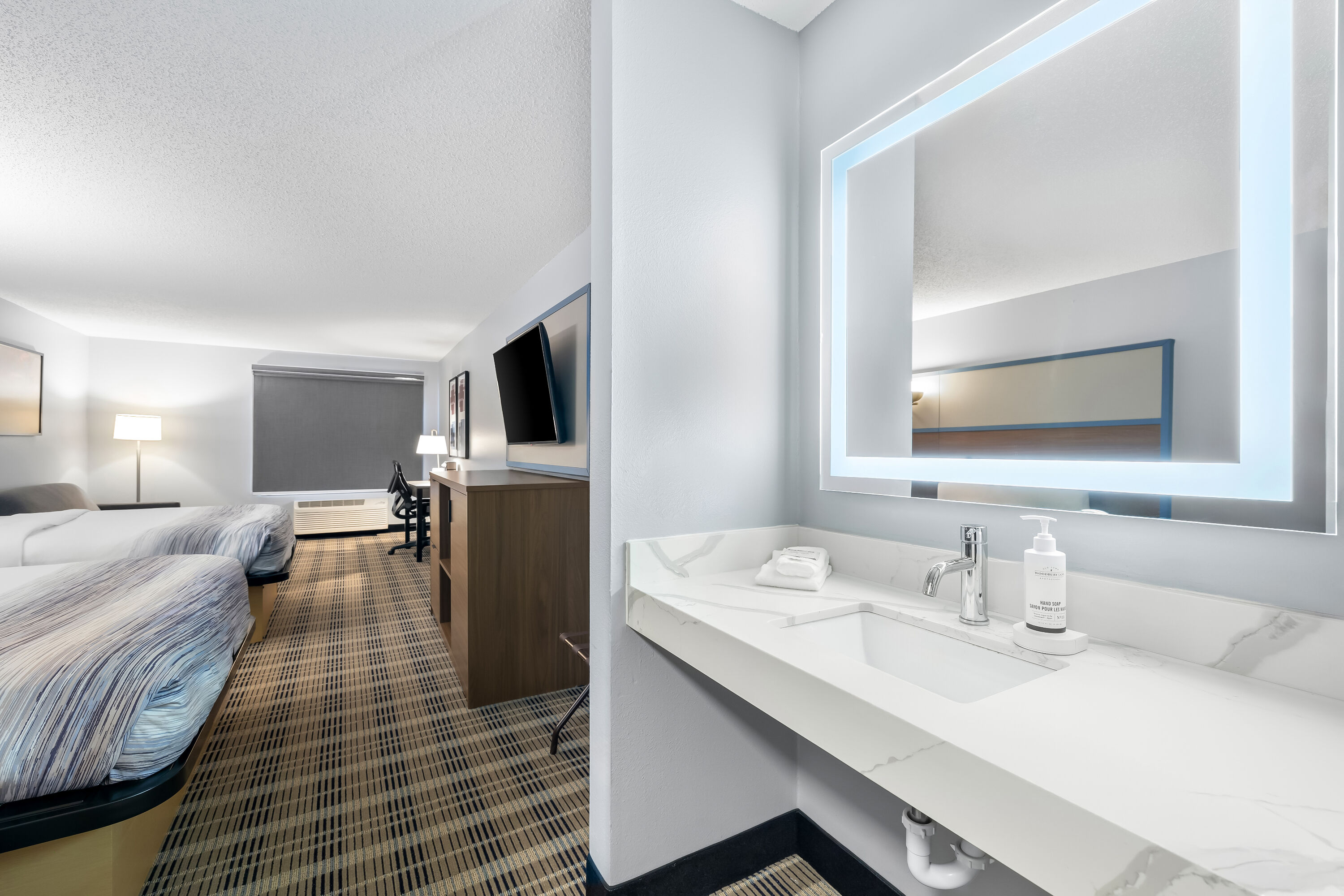 Double bed guest room at the AmericInn by Wyndham Columbus Wisconsin in Columbus, Wisconsin