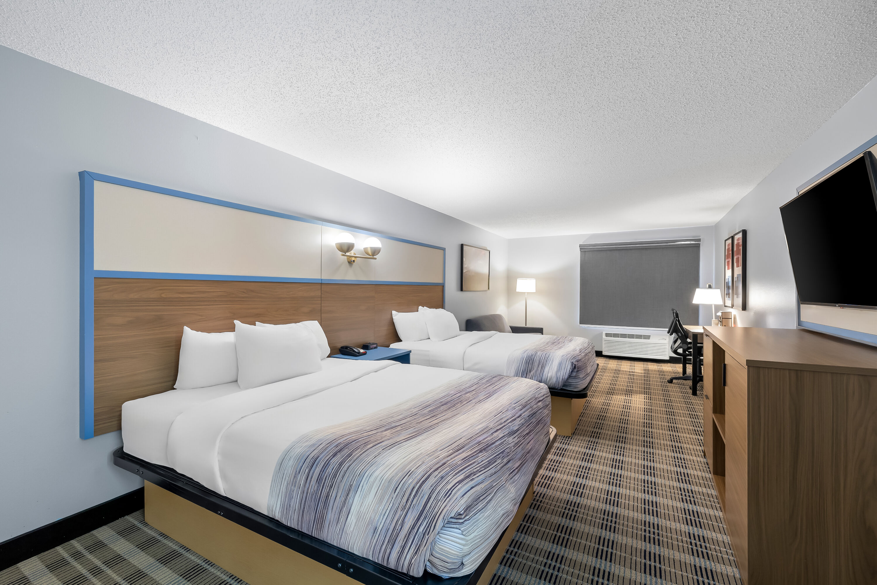 Double bed guest room at the AmericInn by Wyndham Columbus Wisconsin in Columbus, Wisconsin