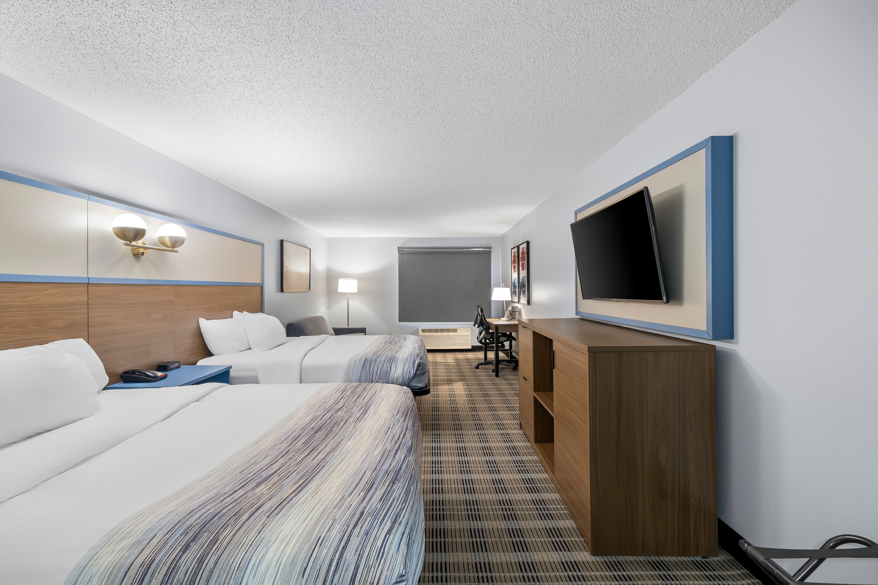 Double bed guest room at the AmericInn by Wyndham Columbus Wisconsin in Columbus, Wisconsin