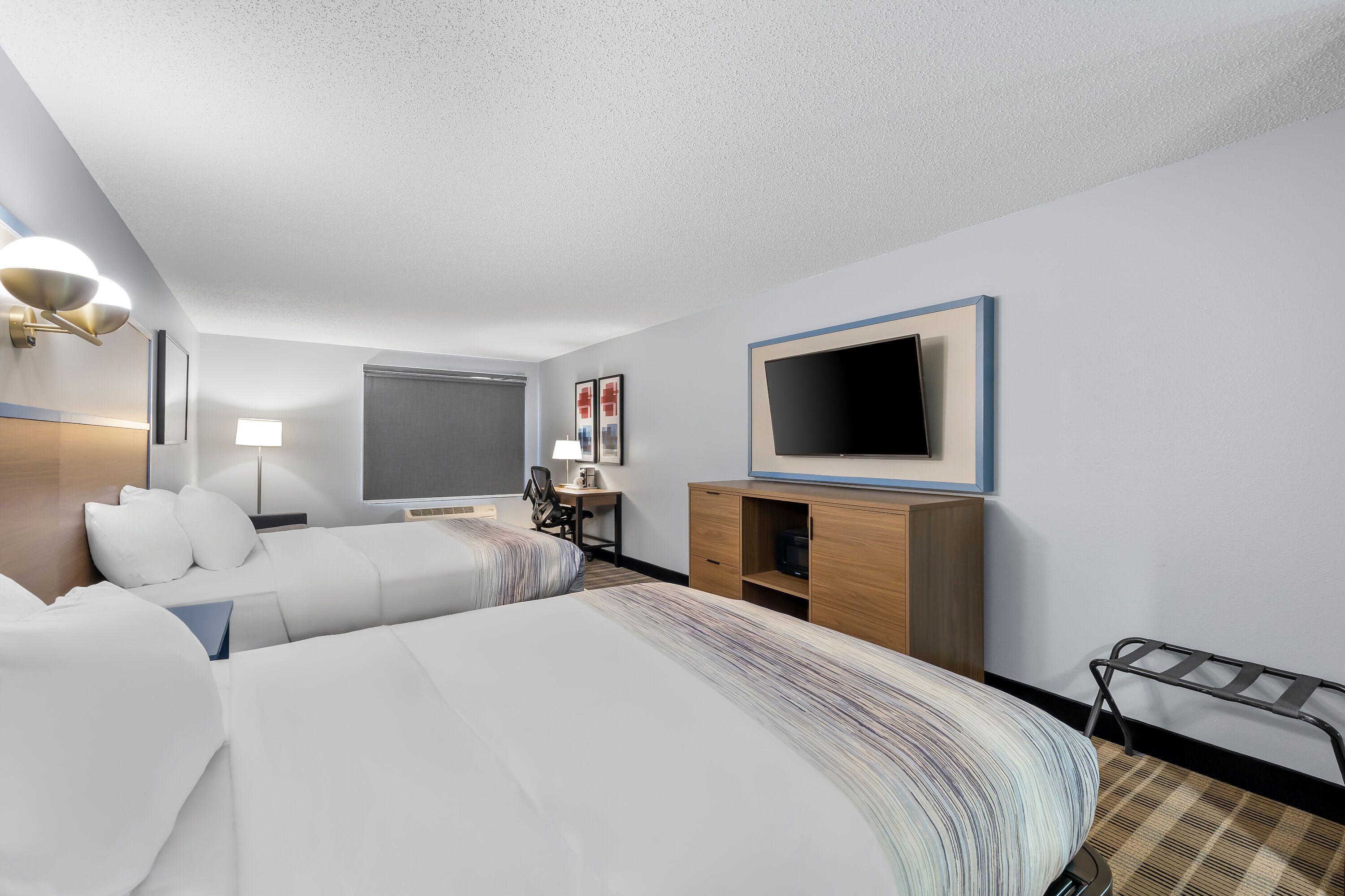 Double bed guest room at the AmericInn by Wyndham Columbus Wisconsin in Columbus, Wisconsin