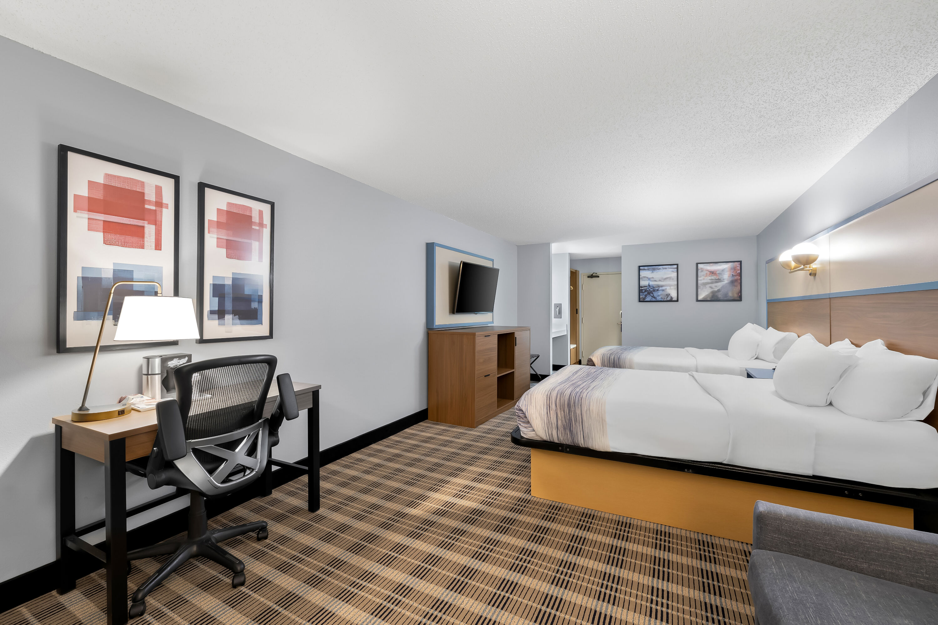 Double bed guest room at the AmericInn by Wyndham Columbus Wisconsin in Columbus, Wisconsin