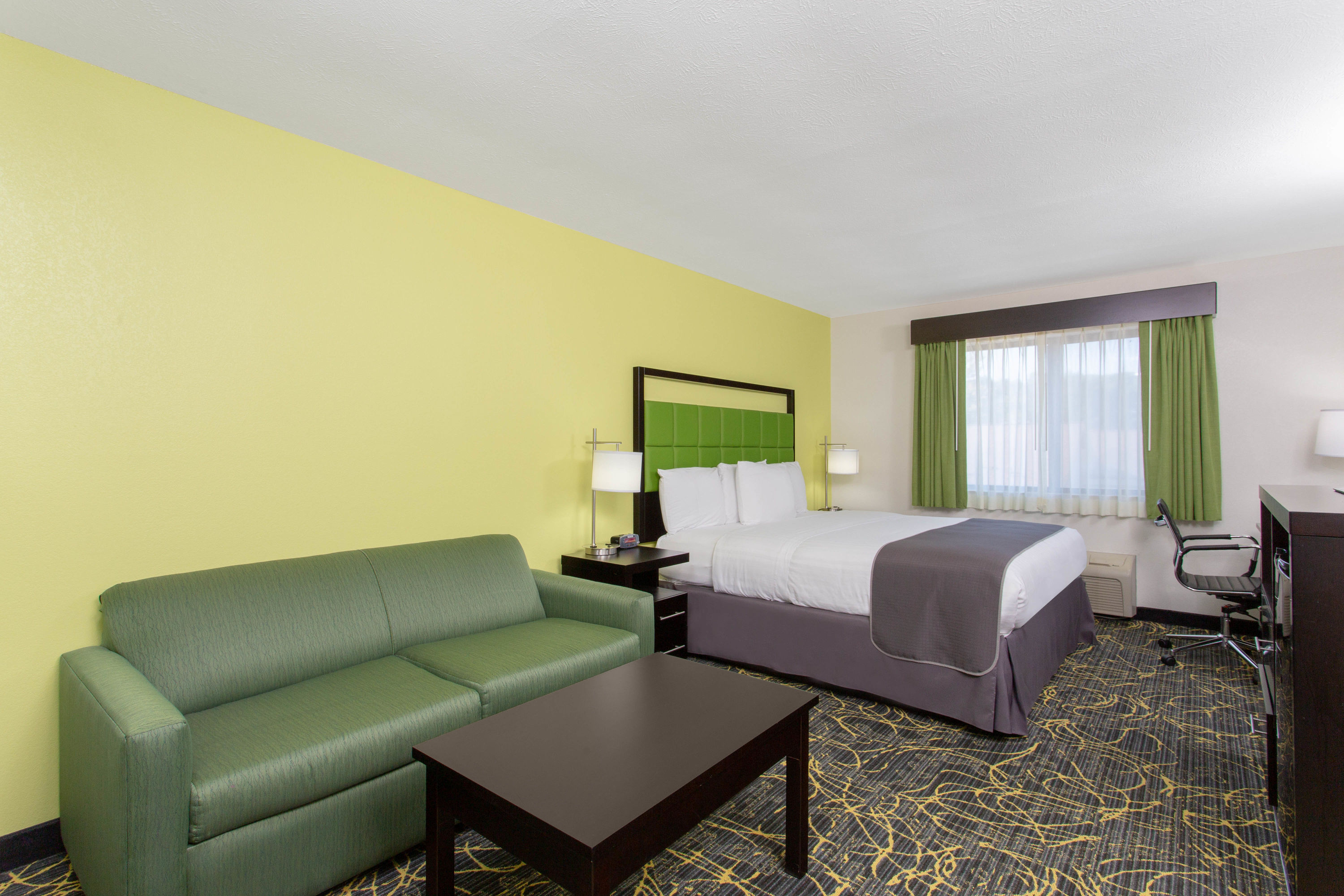 Guest room at the AmericInn by Wyndham Delafield in Delafield, Wisconsin