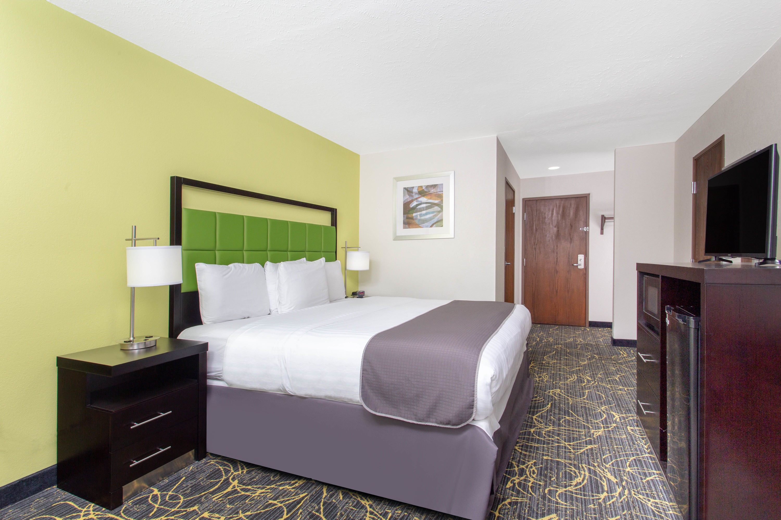 Guest room at the AmericInn by Wyndham Delafield in Delafield, Wisconsin