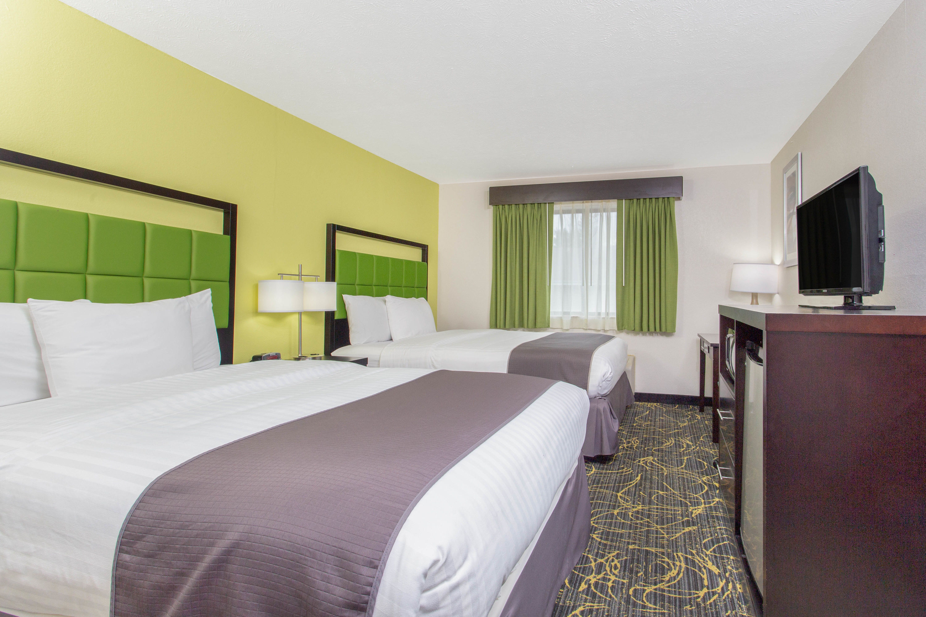 Guest room at the AmericInn by Wyndham Delafield in Delafield, Wisconsin