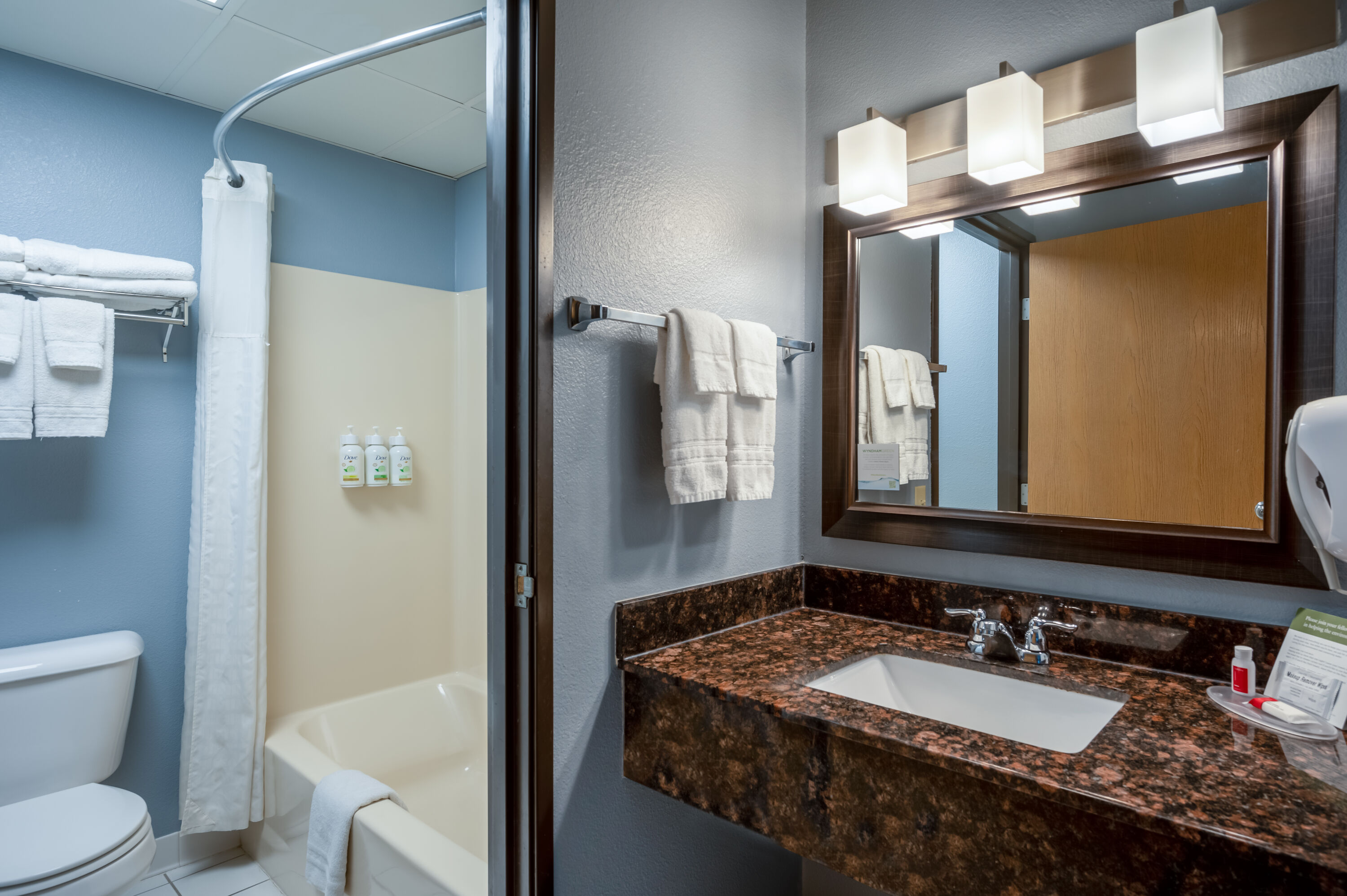 Guest room bath at the AmericInn by Wyndham Eau Claire in Eau Claire, Wisconsin