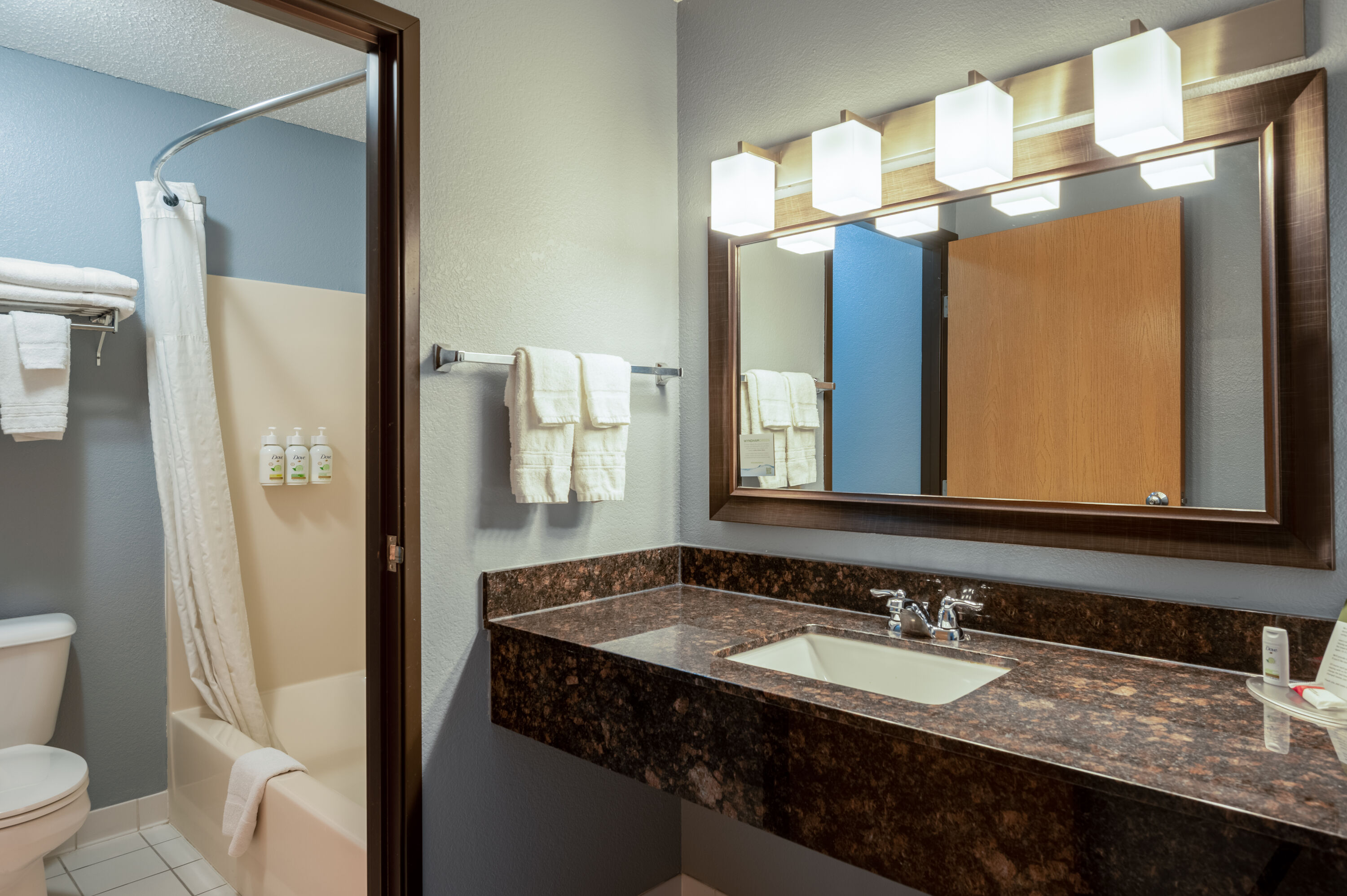 Guest room bath at the AmericInn by Wyndham Eau Claire in Eau Claire, Wisconsin