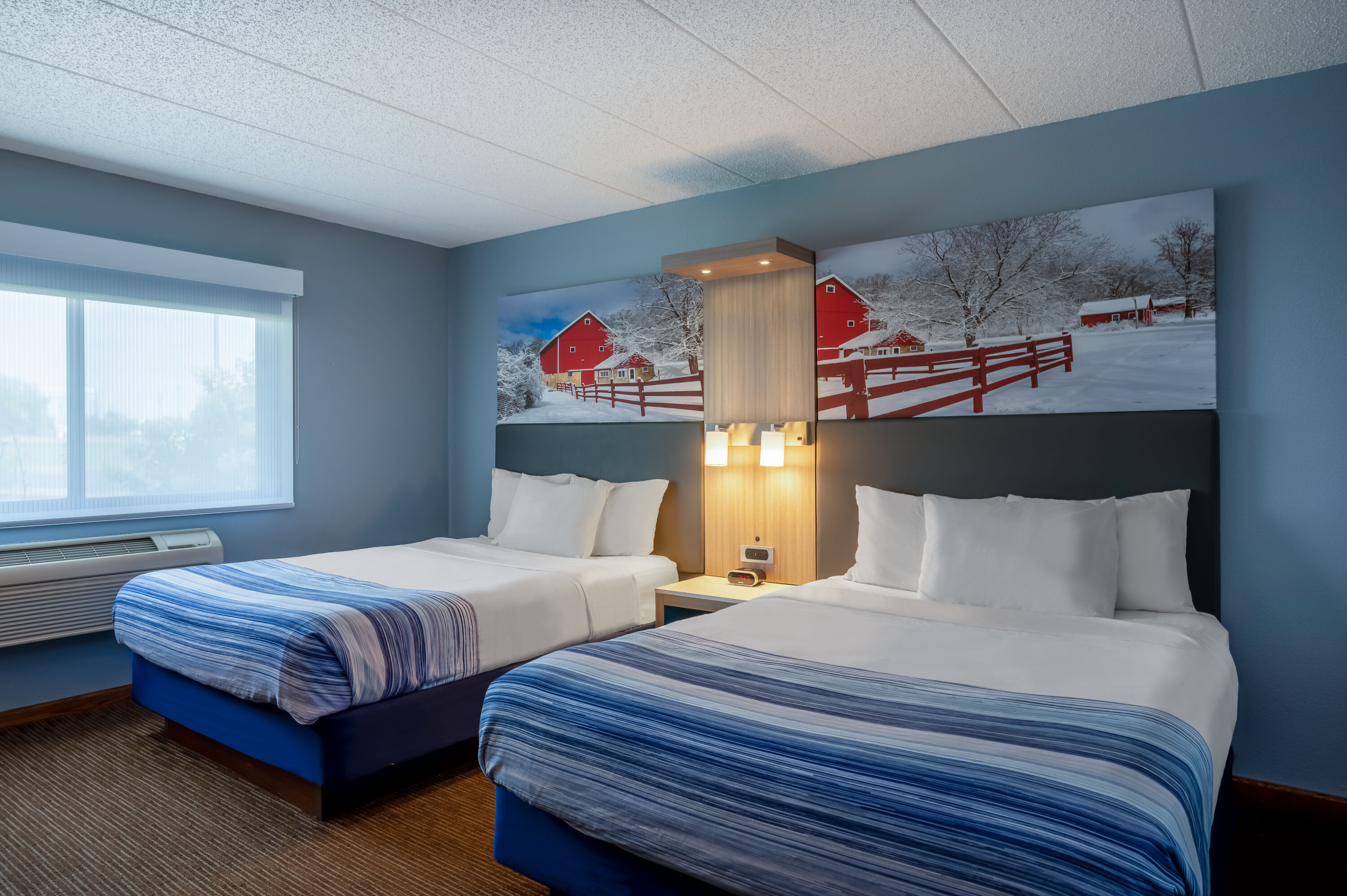 Guest room at the AmericInn by Wyndham Eau Claire in Eau Claire, Wisconsin