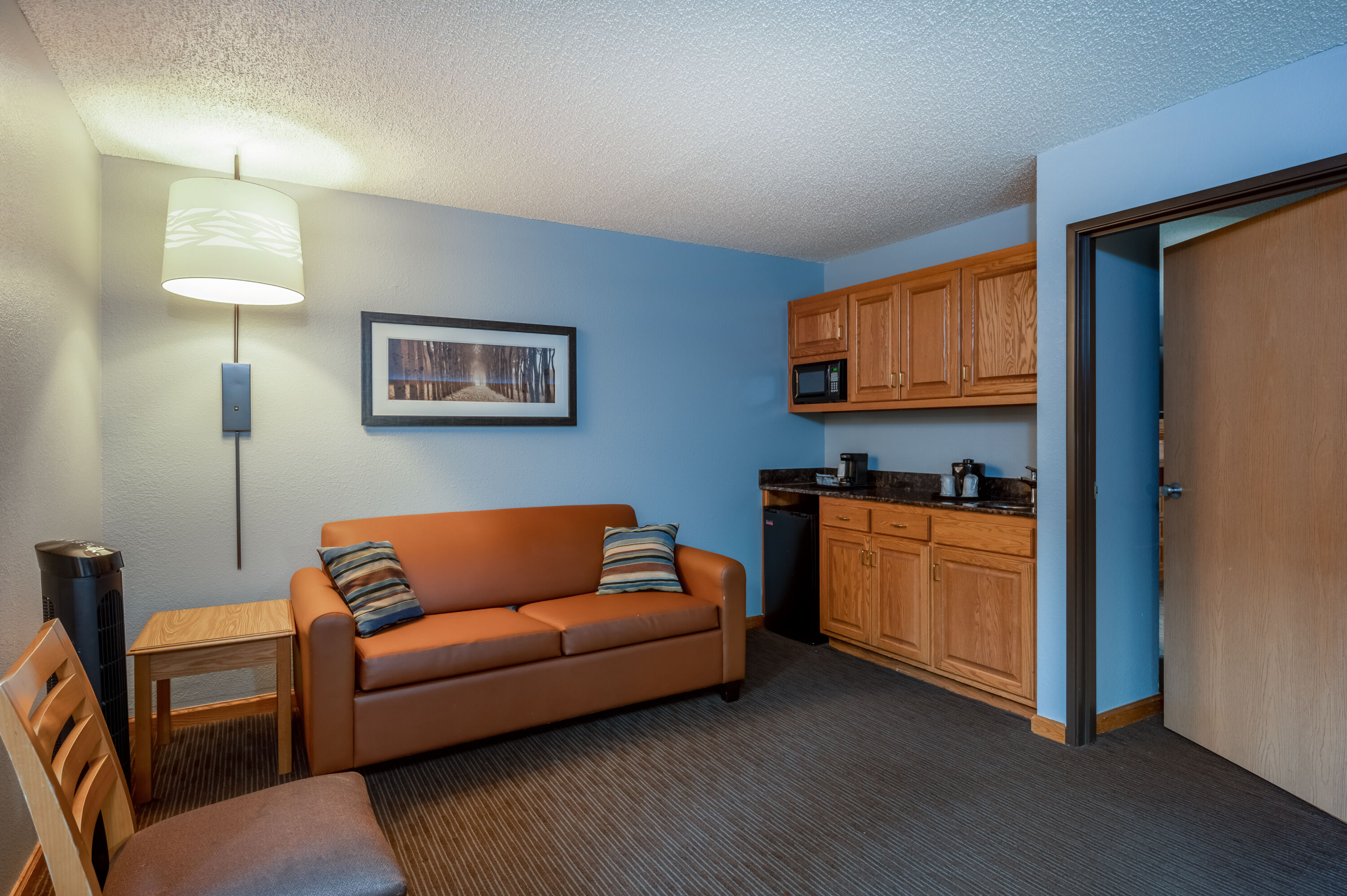 Guest room at the AmericInn by Wyndham Eau Claire in Eau Claire, Wisconsin
