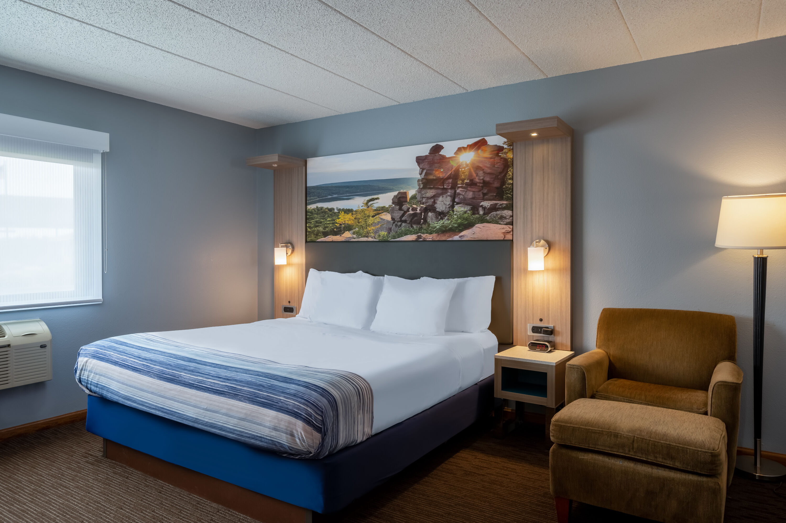 Guest room at the AmericInn by Wyndham Eau Claire in Eau Claire, Wisconsin