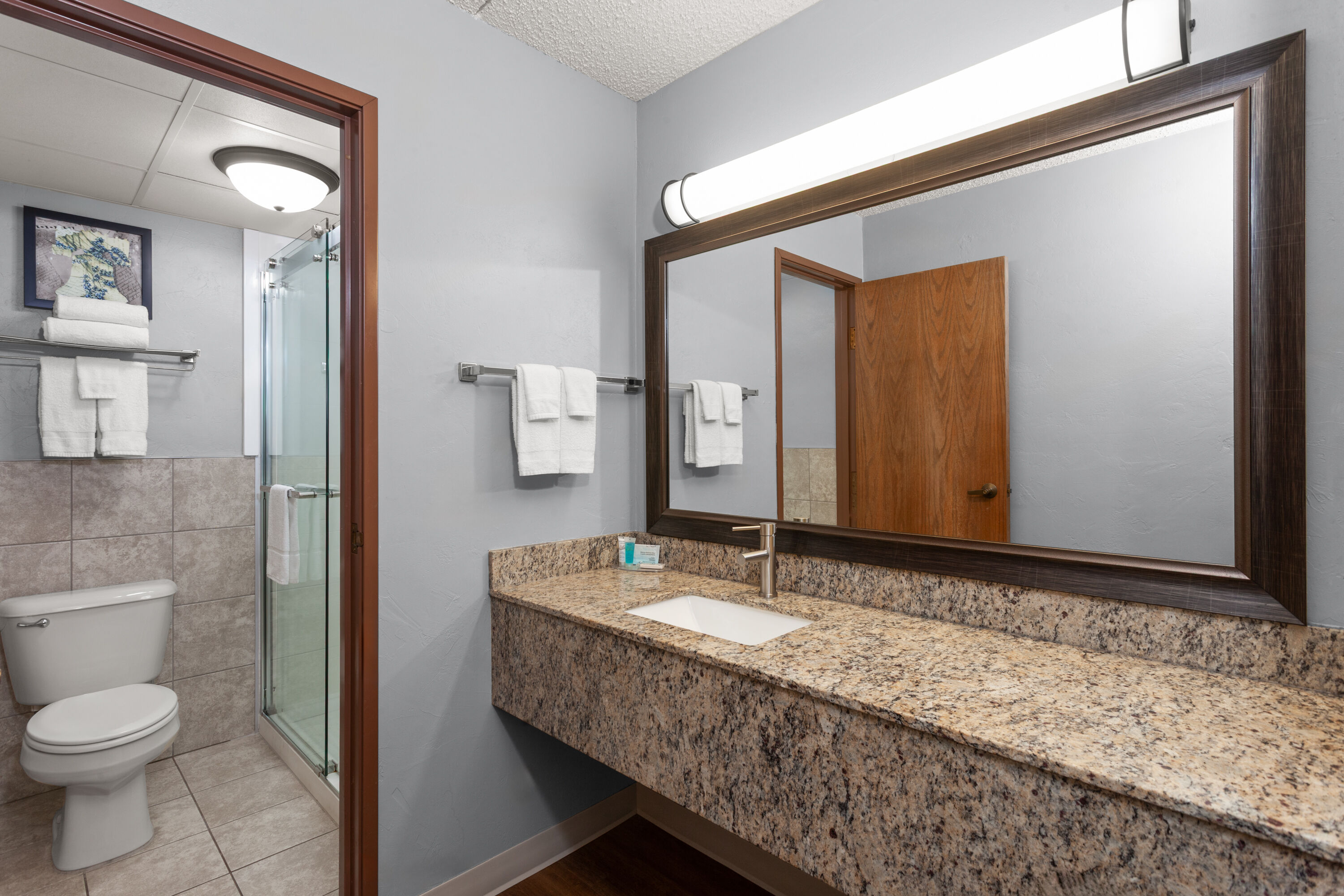 Guest room bath at the AmericInn by Wyndham Green Bay West in Green Bay, Wisconsin