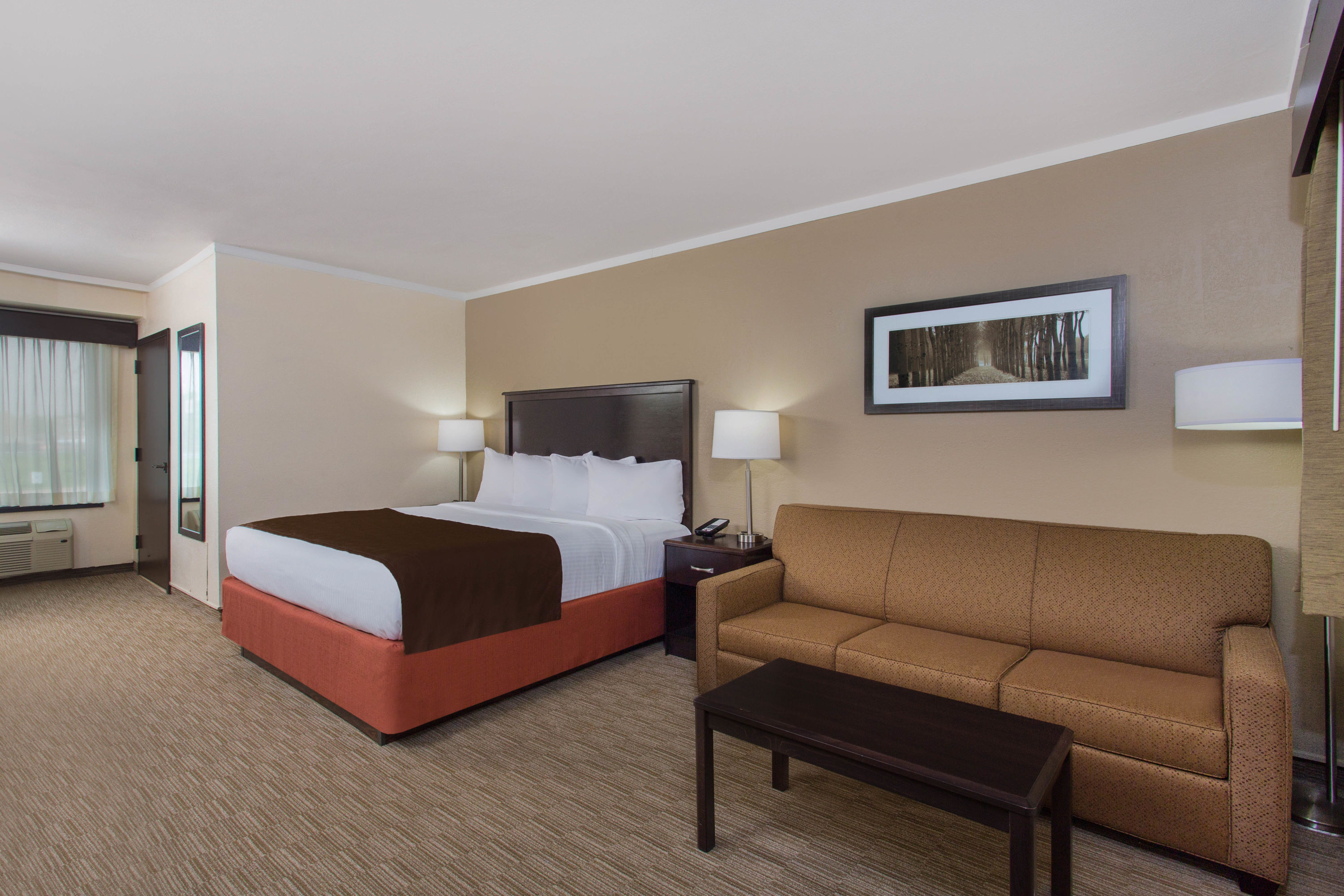 Guest room at the AmericInn by Wyndham Janesville in Janesville, Wisconsin