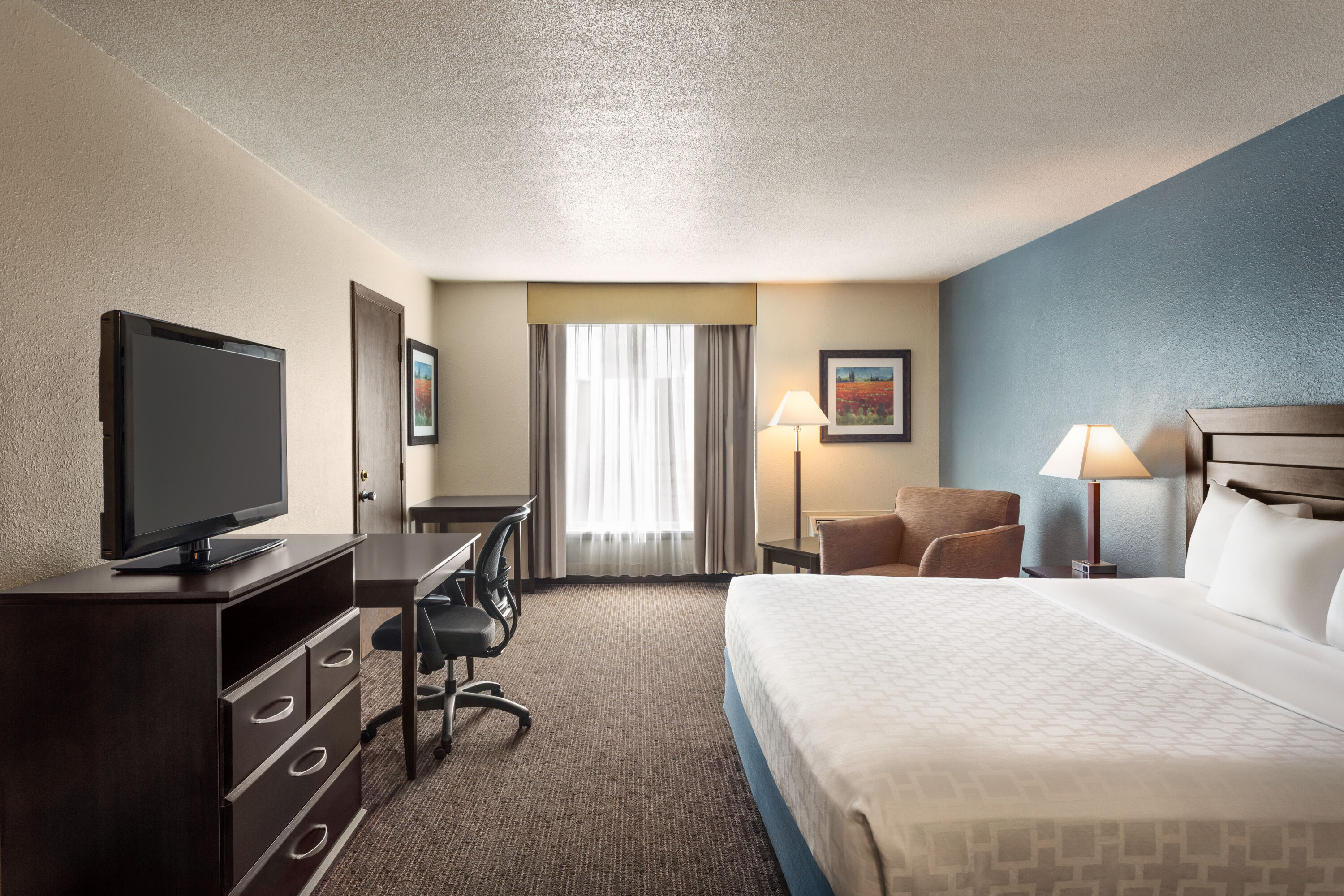 Guest room at the AmericInn by Wyndham La Crosse Riverfront Conference Center in La Crosse, Wisconsin
