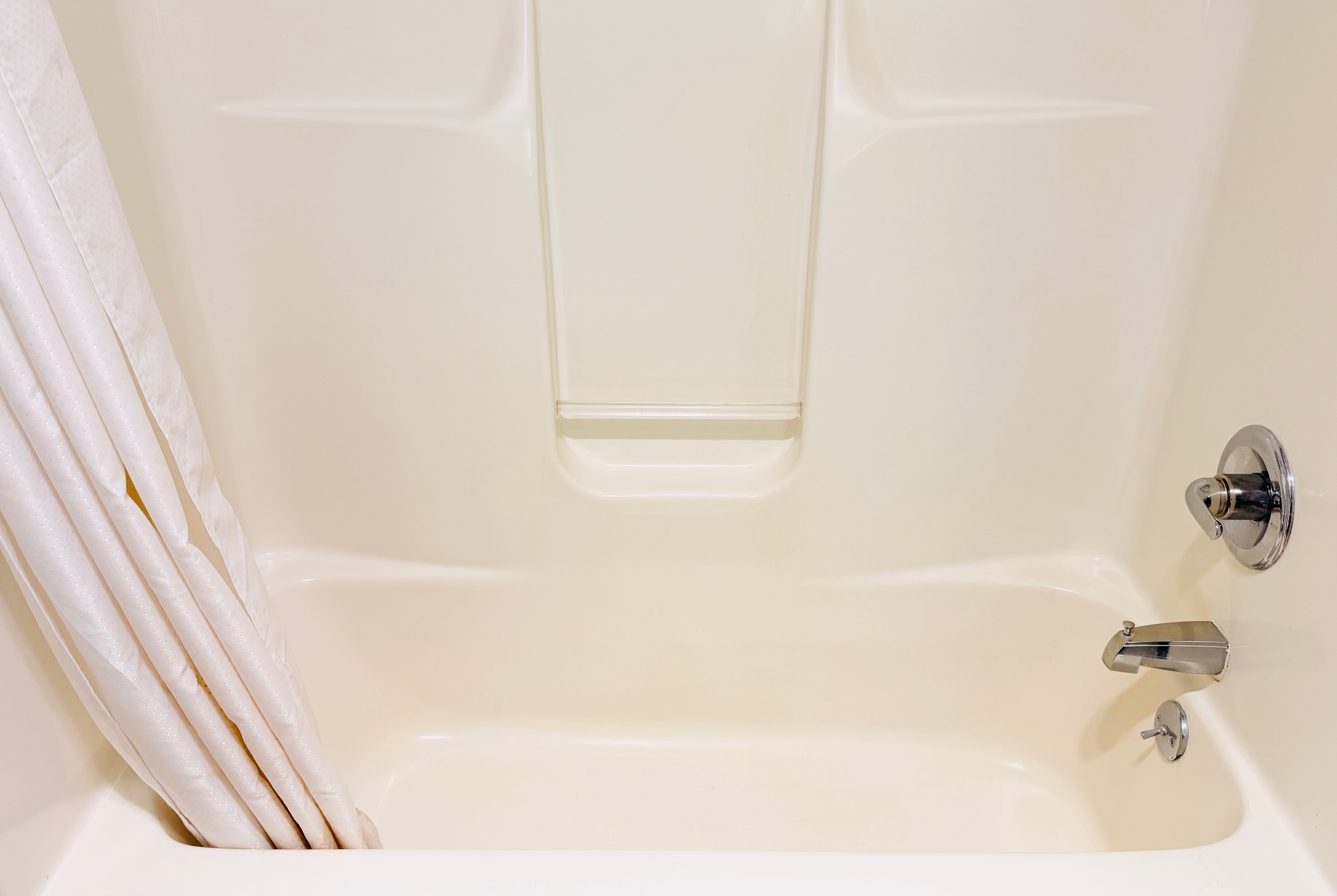 Guest room bath at the AmericInn by Wyndham Lake Mills in Lake Mills, Wisconsin