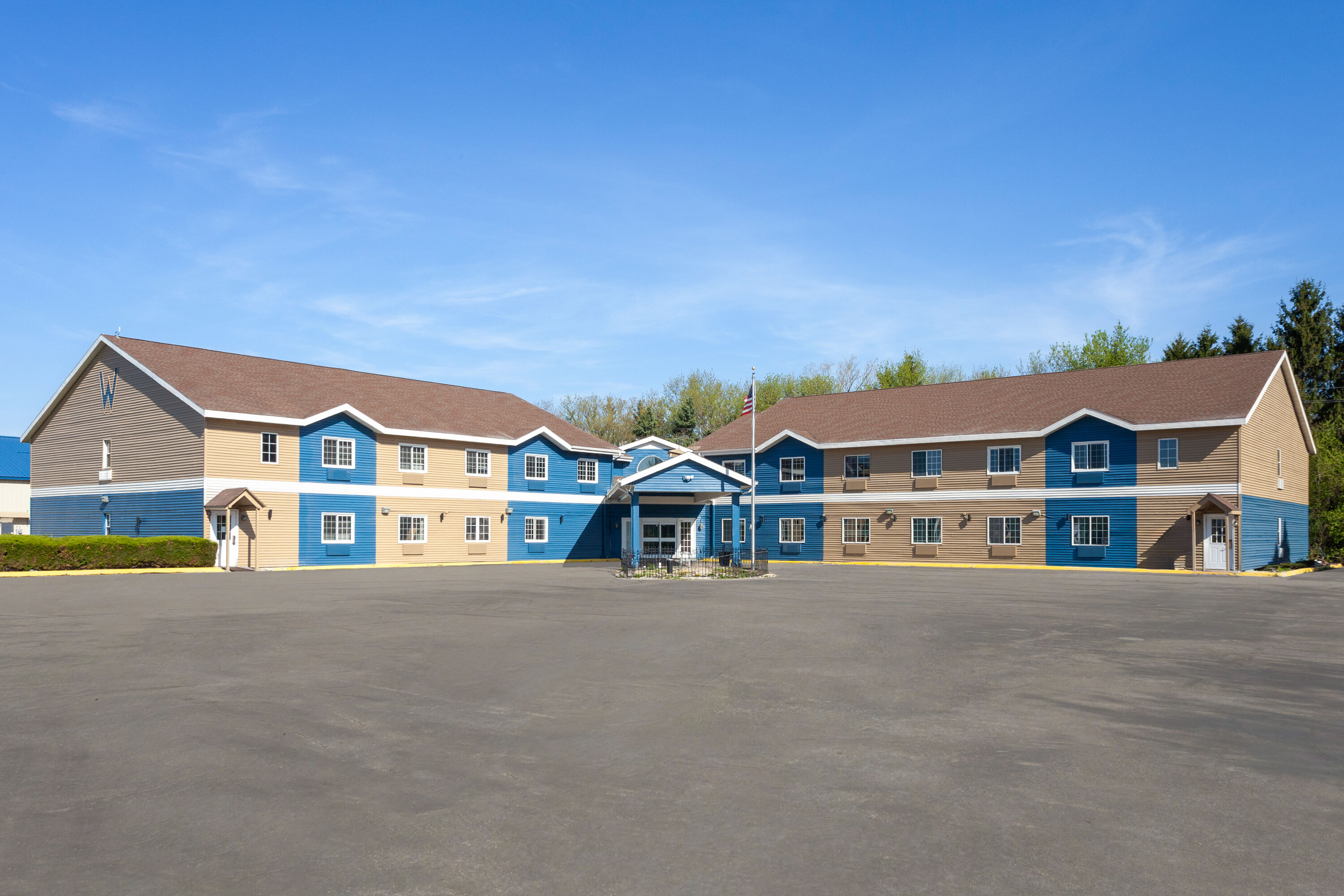 Exterior Day Image of AmericInn by Wyndham Lake Mills hotel in Lake Mills, Wisconsin