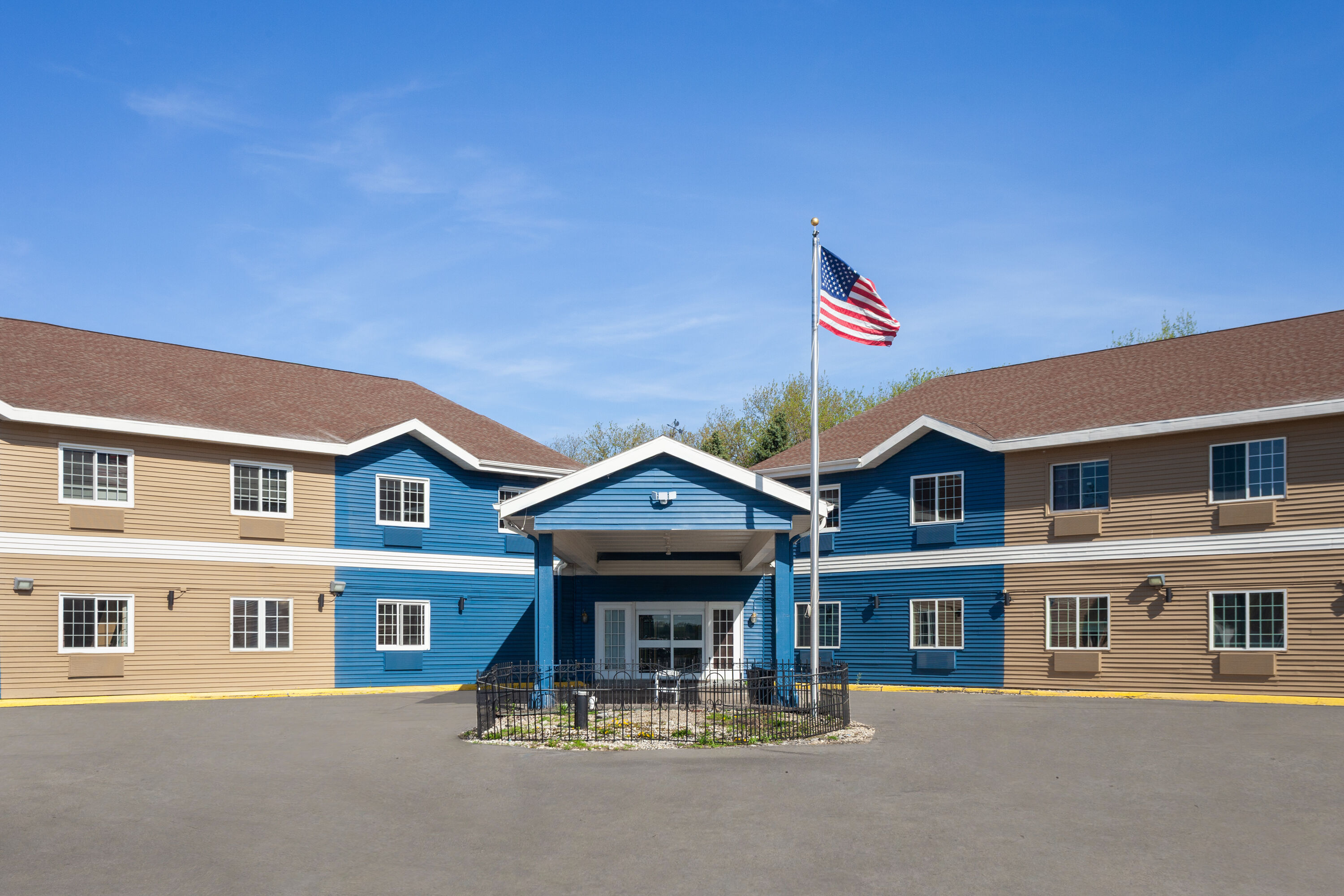 Exterior Day Image of AmericInn by Wyndham Lake Mills hotel in Lake Mills, Wisconsin