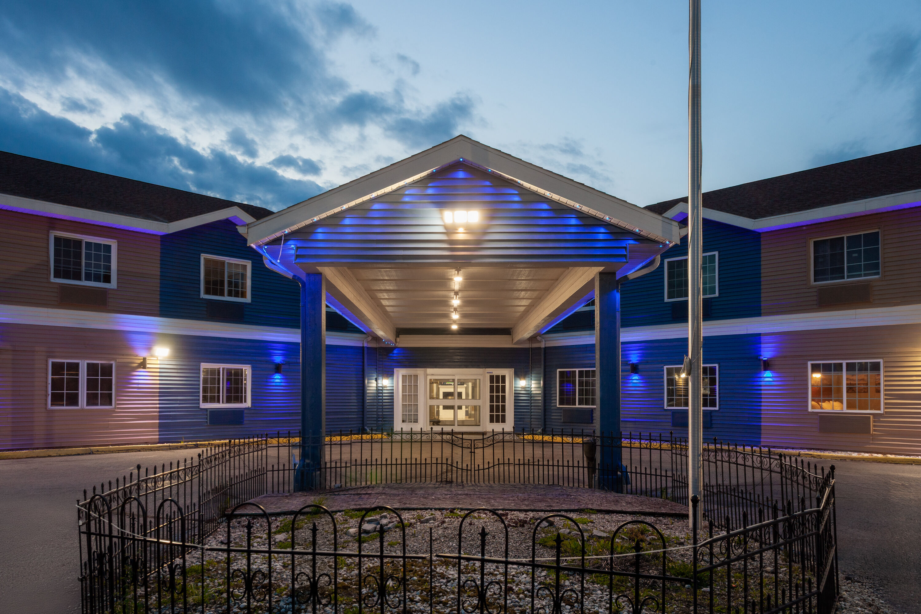Exterior Dusk Image of AmericInn by Wyndham Lake Mills hotel in Lake Mills, Wisconsin