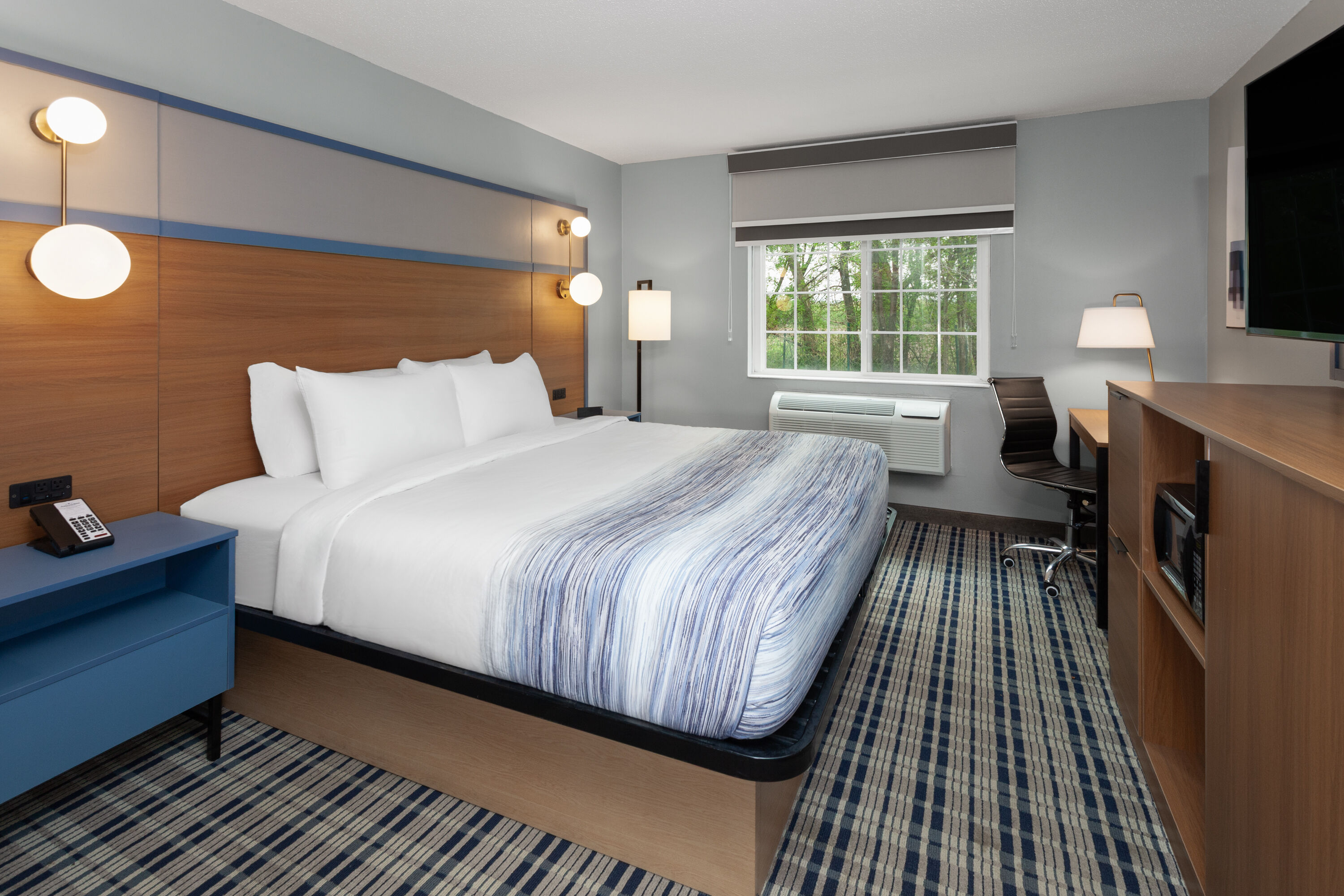 Guest room at the AmericInn by Wyndham Lake Mills in Lake Mills, Wisconsin