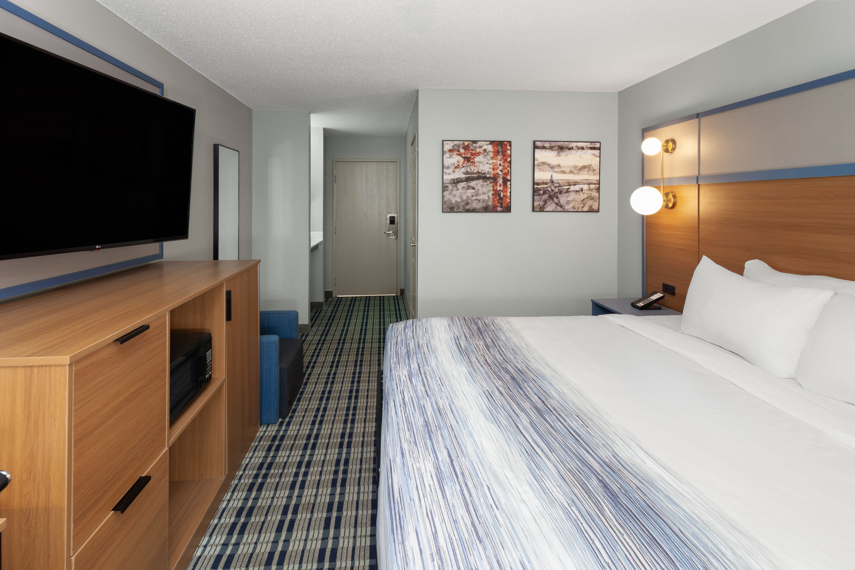 Guest room at the AmericInn by Wyndham Lake Mills in Lake Mills, Wisconsin