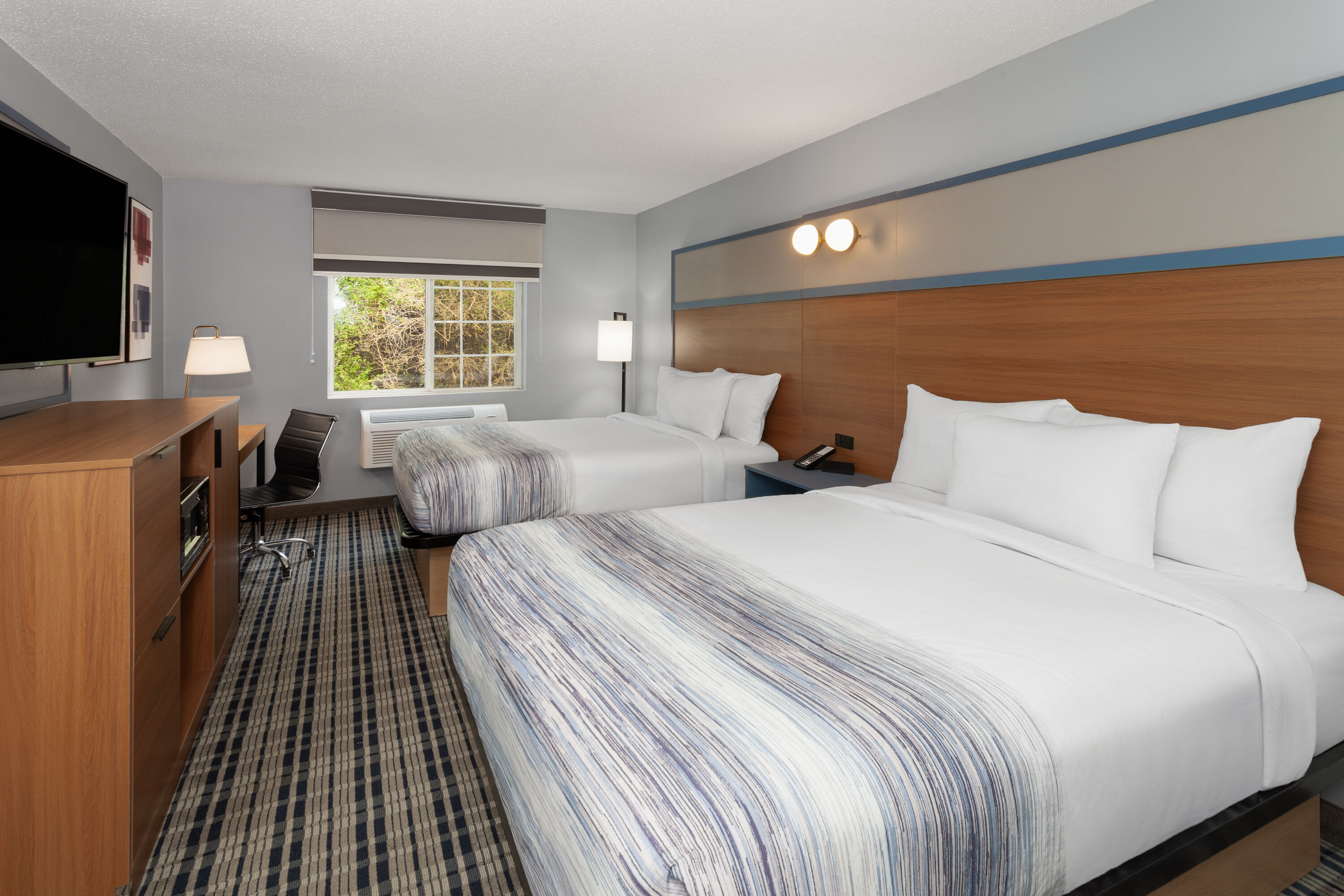 Guest room at the AmericInn by Wyndham Lake Mills in Lake Mills, Wisconsin