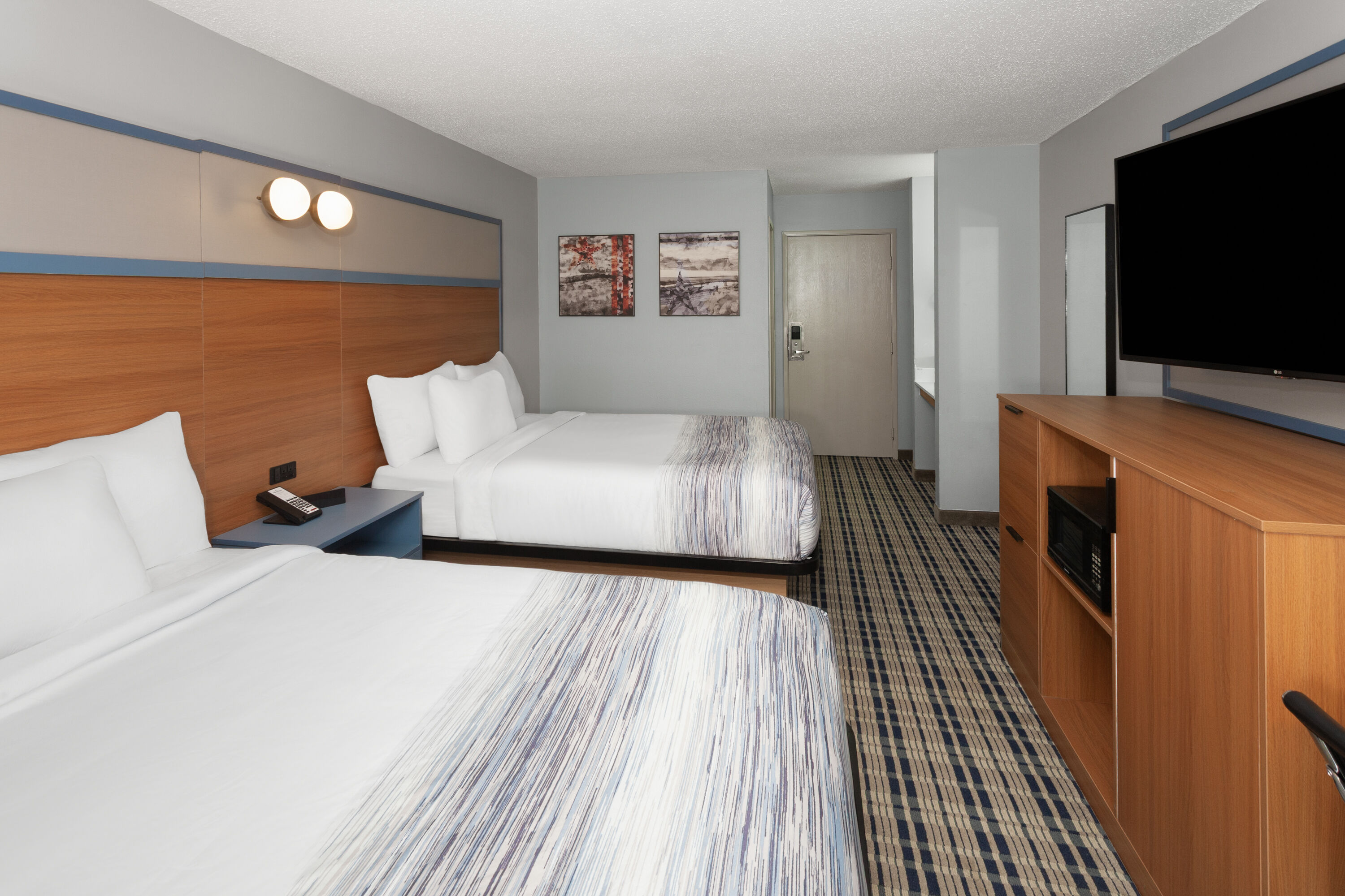 Guest room at the AmericInn by Wyndham Lake Mills in Lake Mills, Wisconsin