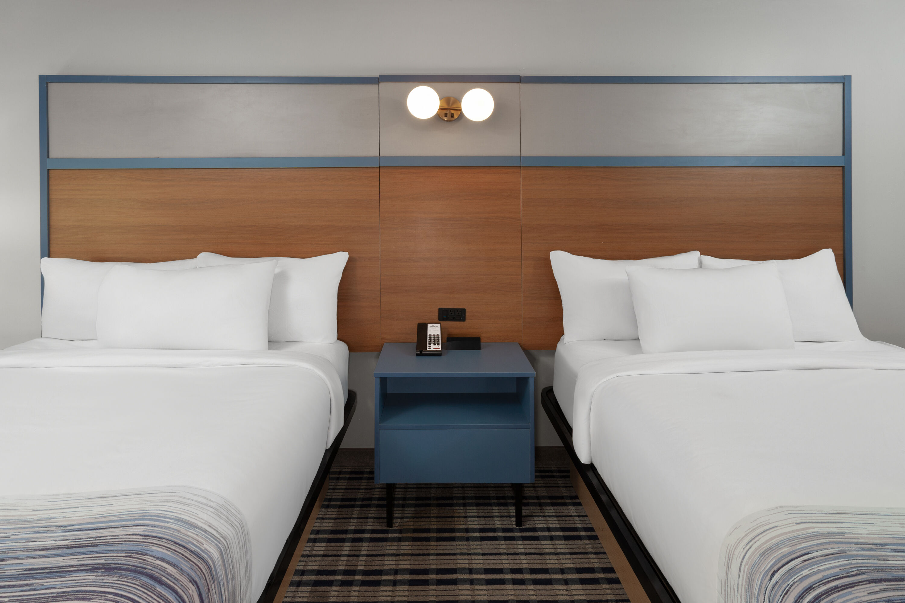 Guest room at the AmericInn by Wyndham Lake Mills in Lake Mills, Wisconsin