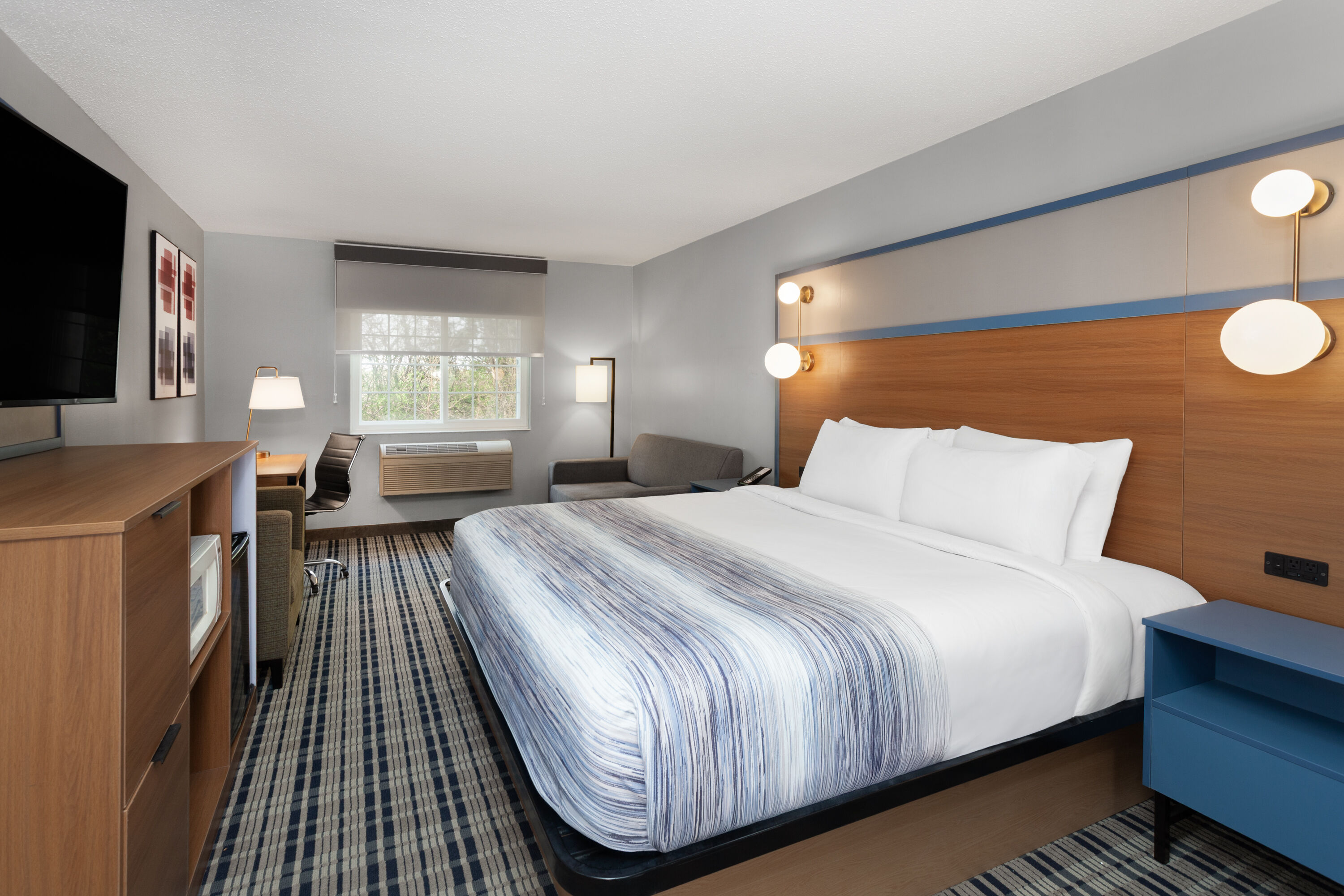 Guest room at the AmericInn by Wyndham Lake Mills in Lake Mills, Wisconsin