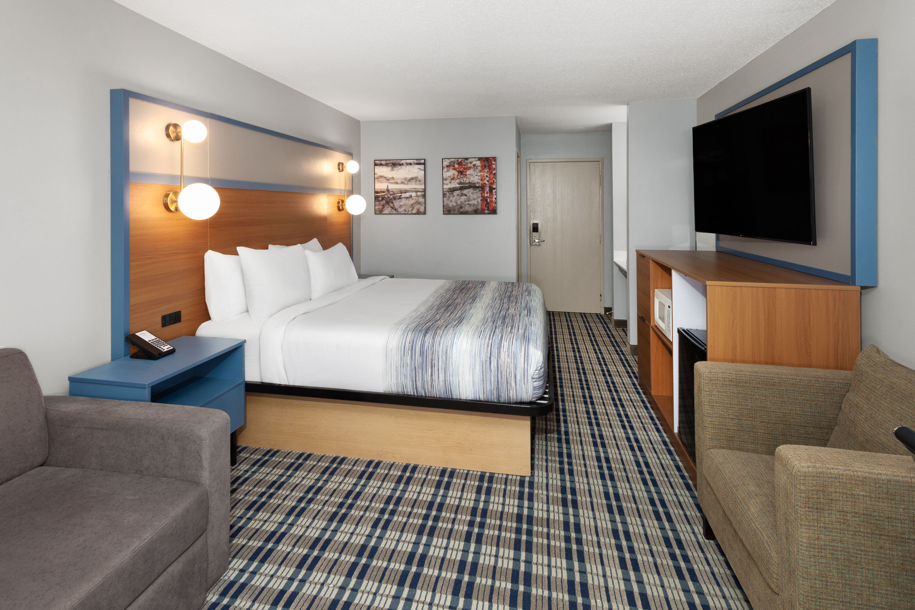 Guest room at the AmericInn by Wyndham Lake Mills in Lake Mills, Wisconsin