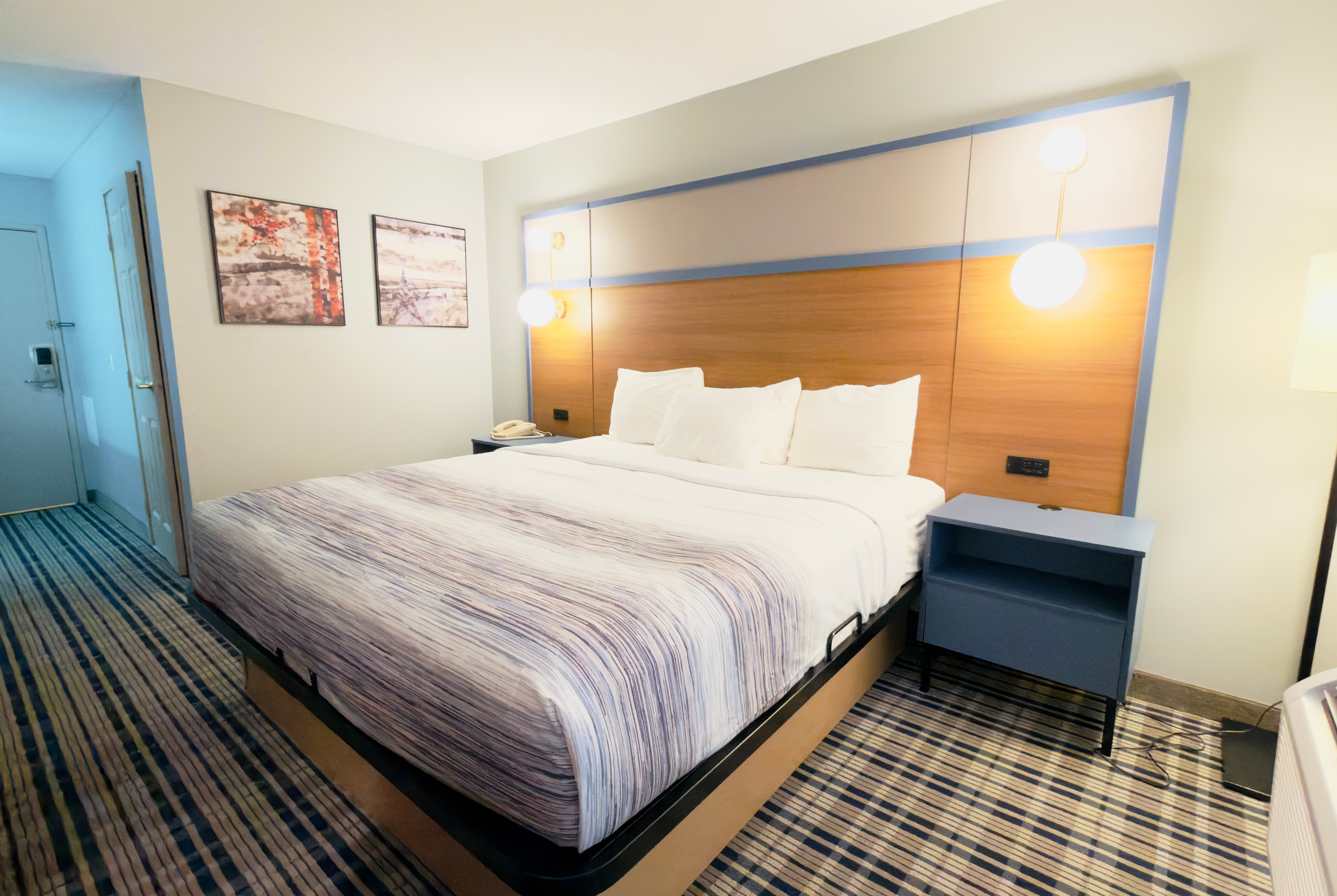 Guest room at the AmericInn by Wyndham Lake Mills in Lake Mills, Wisconsin