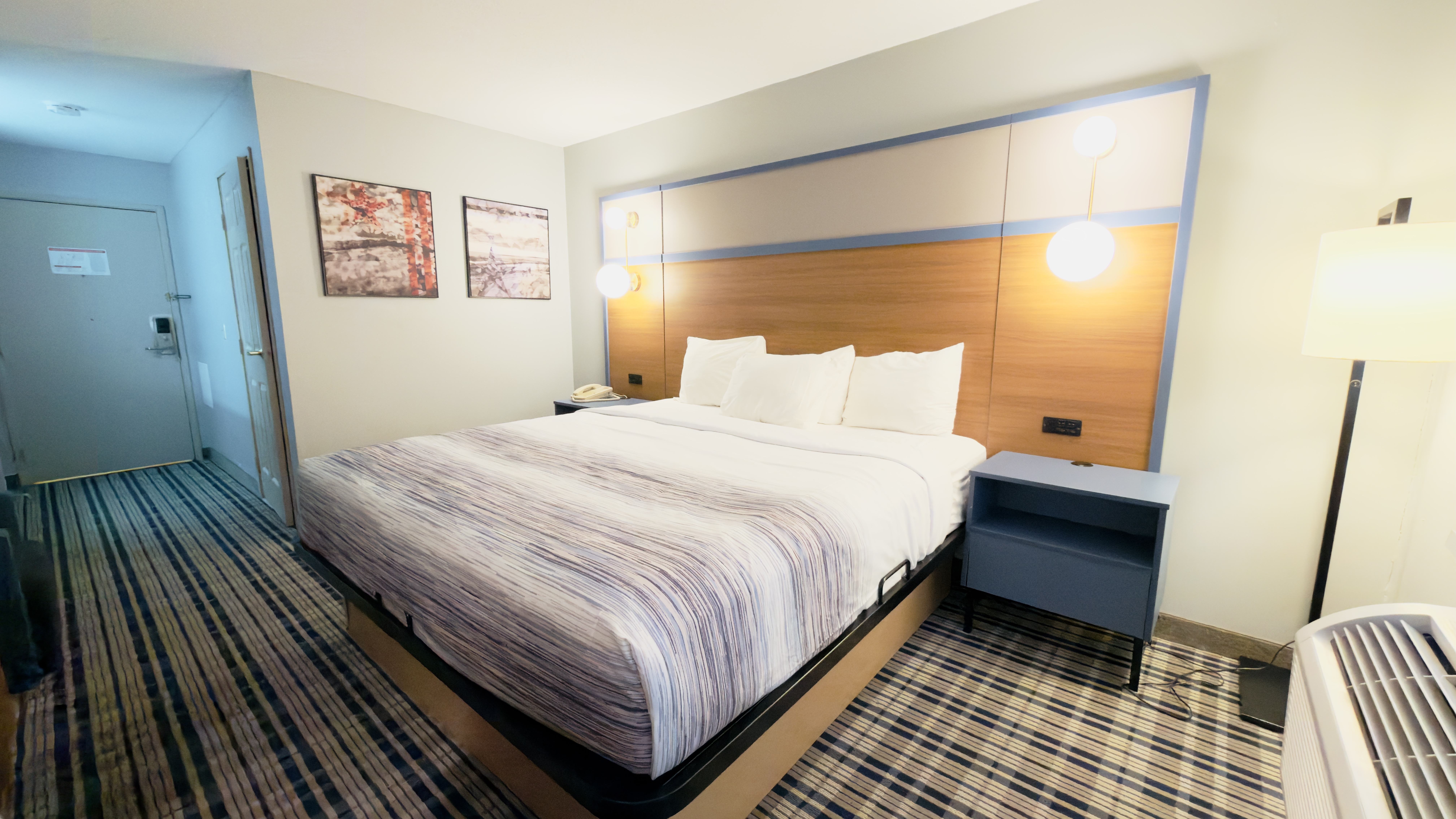 Guest room at the AmericInn by Wyndham Lake Mills in Lake Mills, Wisconsin