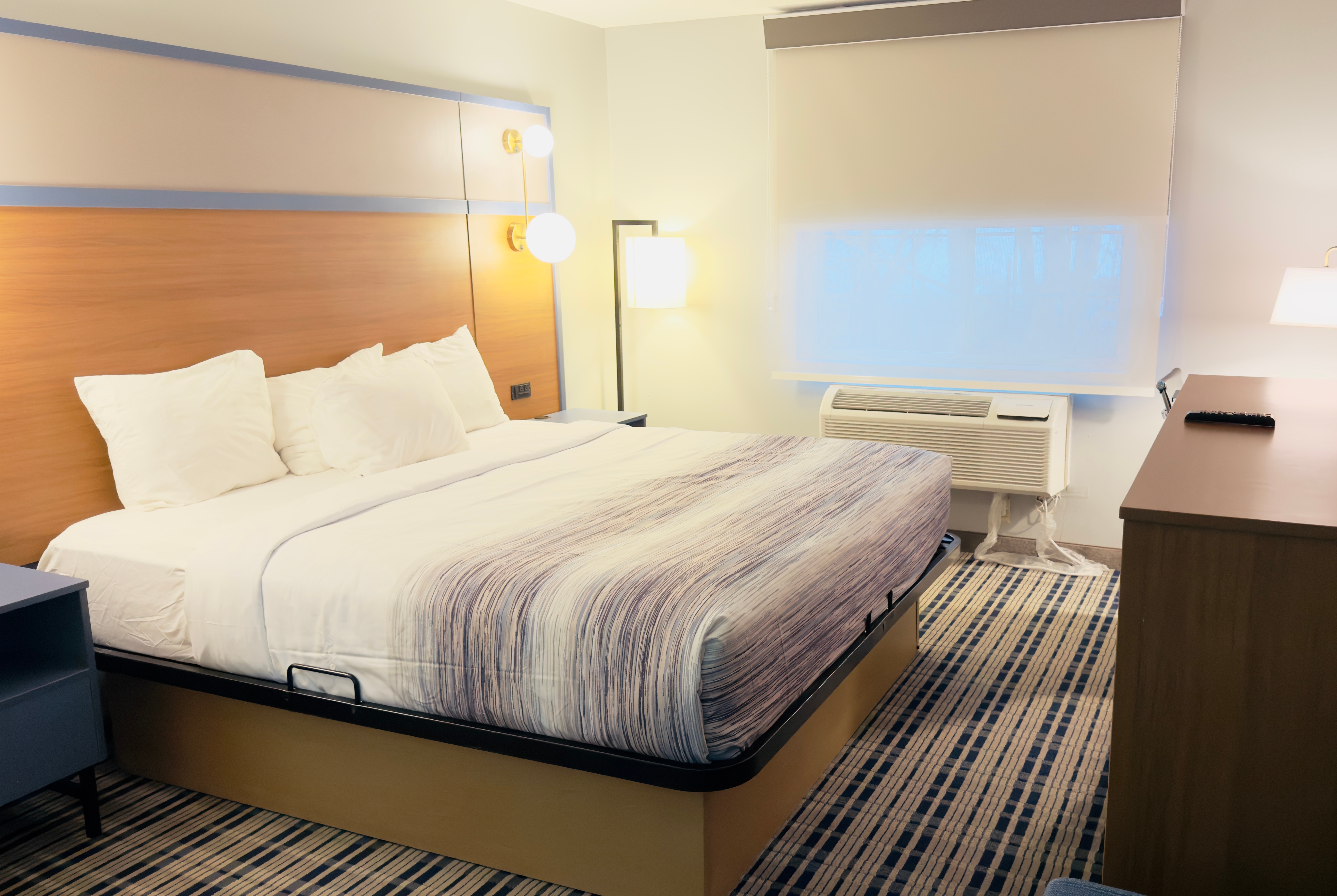 Guest room at the AmericInn by Wyndham Lake Mills in Lake Mills, Wisconsin