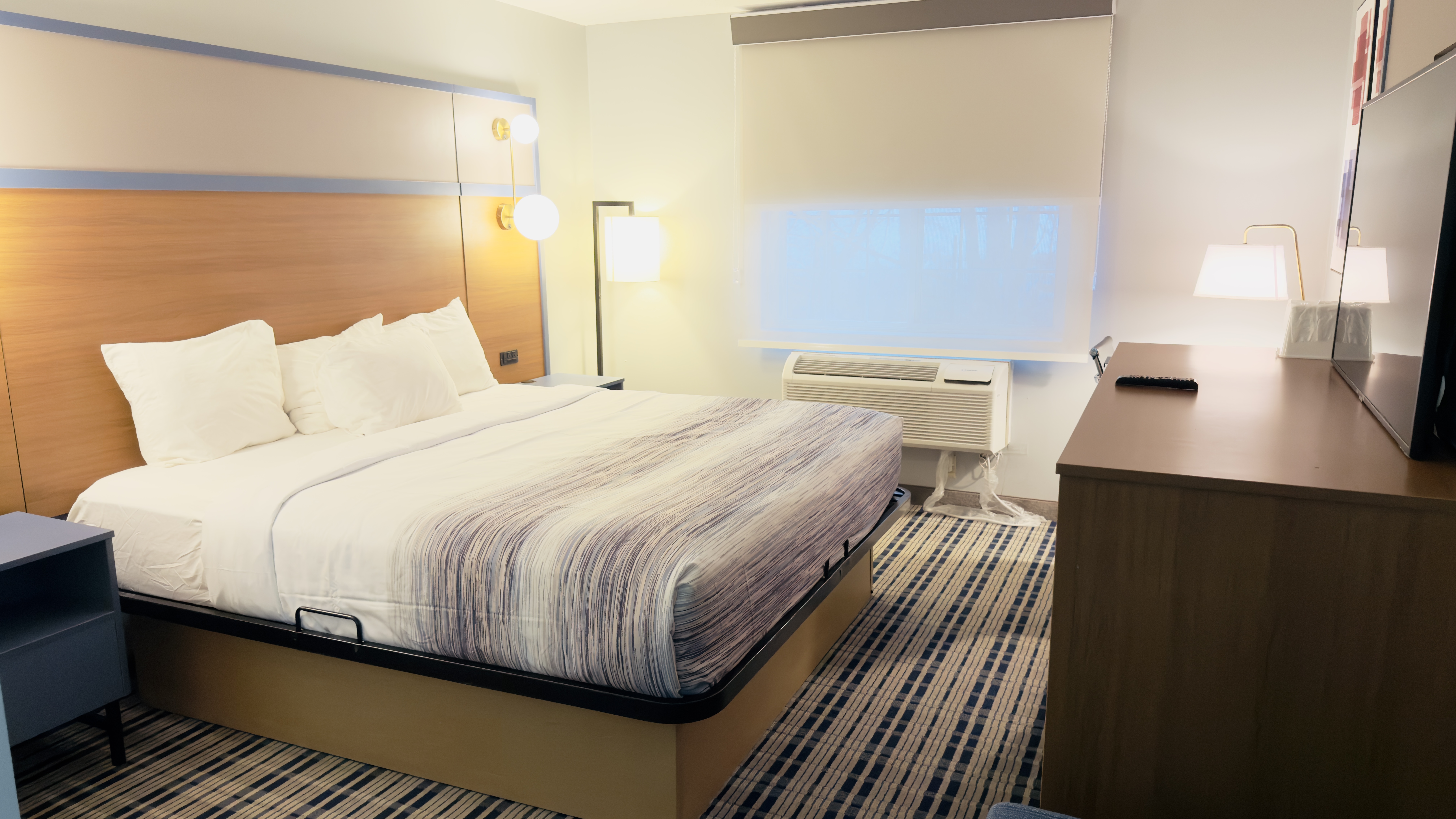 Guest room at the AmericInn by Wyndham Lake Mills in Lake Mills, Wisconsin