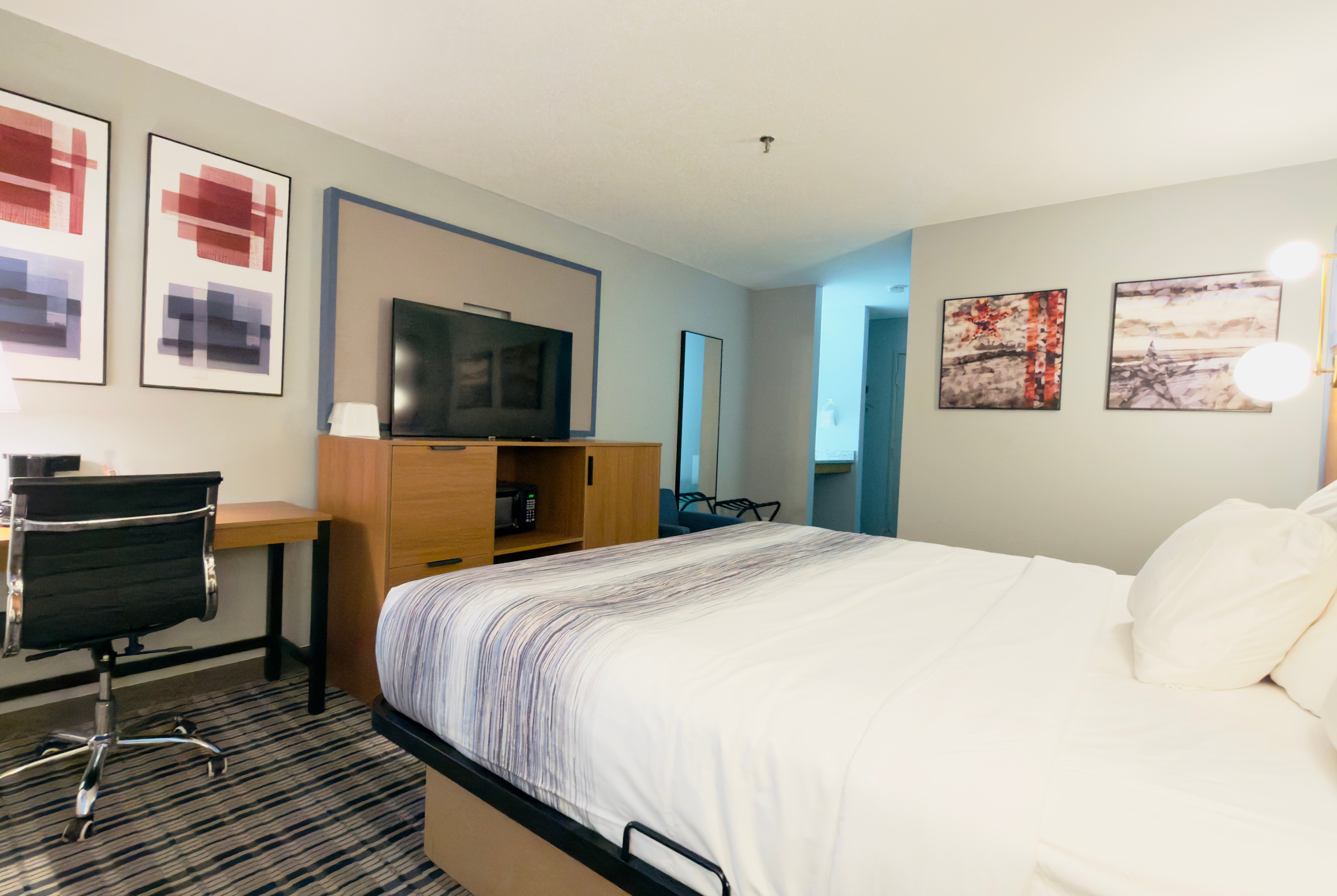 Guest room at the AmericInn by Wyndham Lake Mills in Lake Mills, Wisconsin