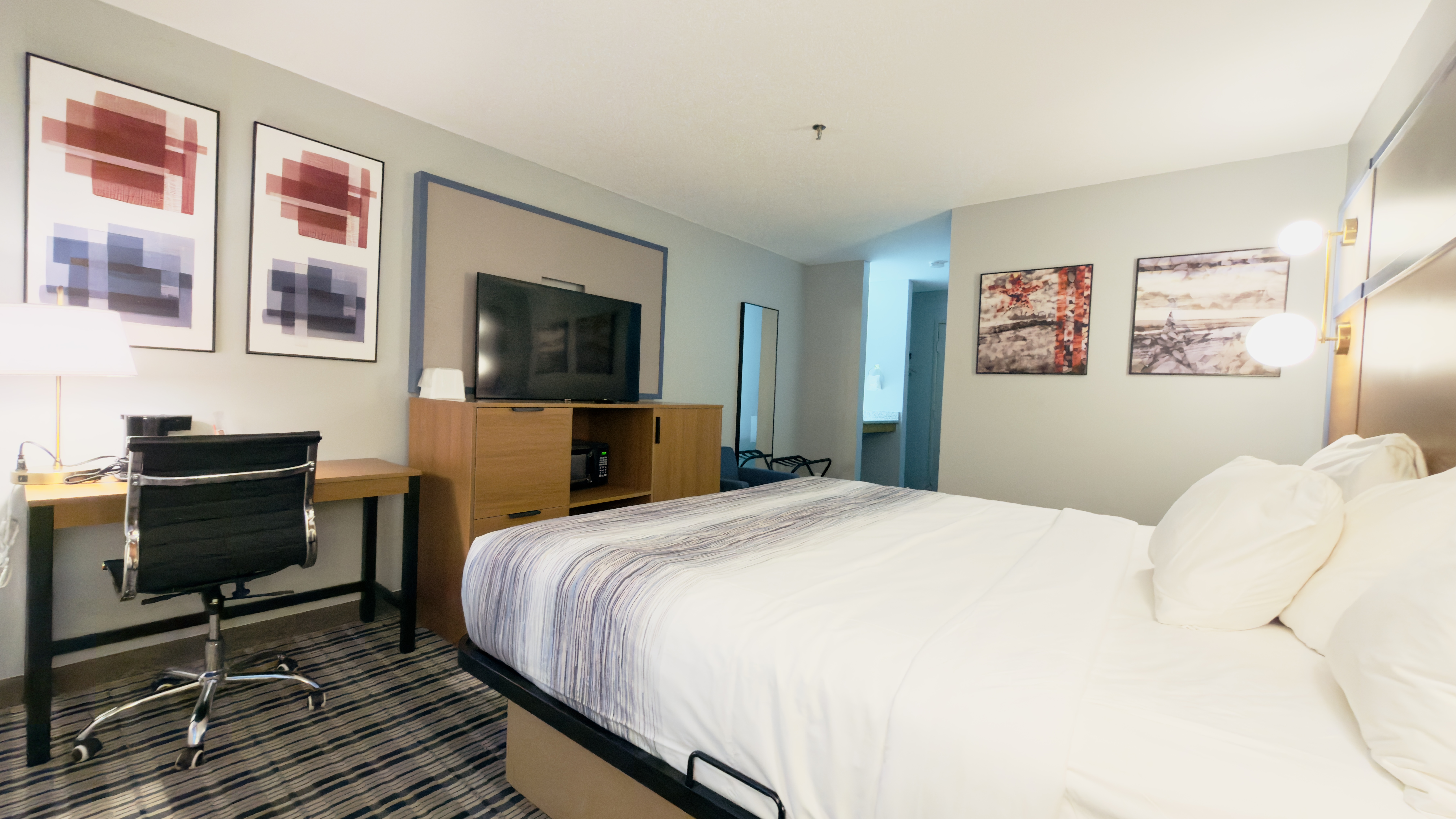 Guest room at the AmericInn by Wyndham Lake Mills in Lake Mills, Wisconsin