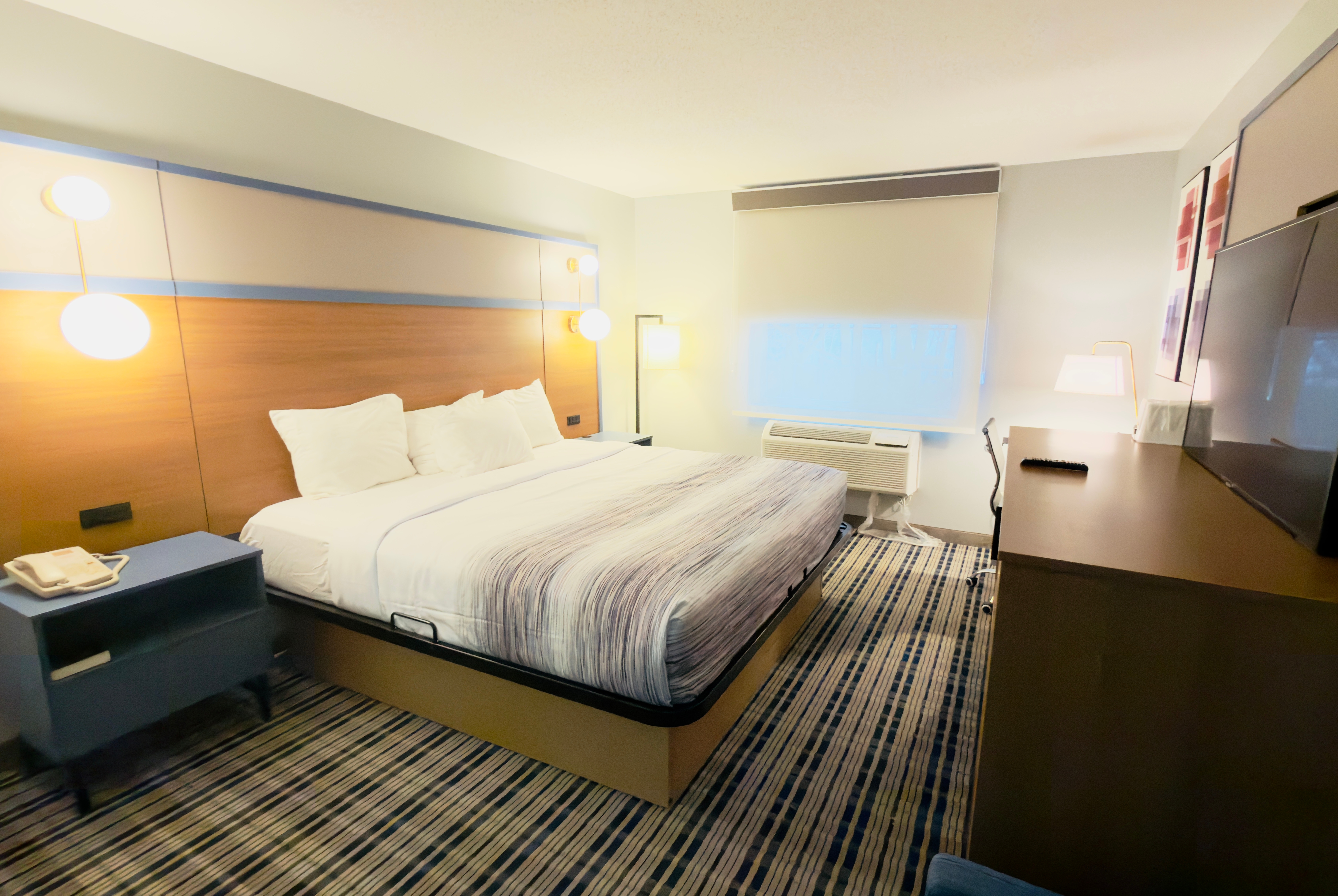 Guest room at the AmericInn by Wyndham Lake Mills in Lake Mills, Wisconsin