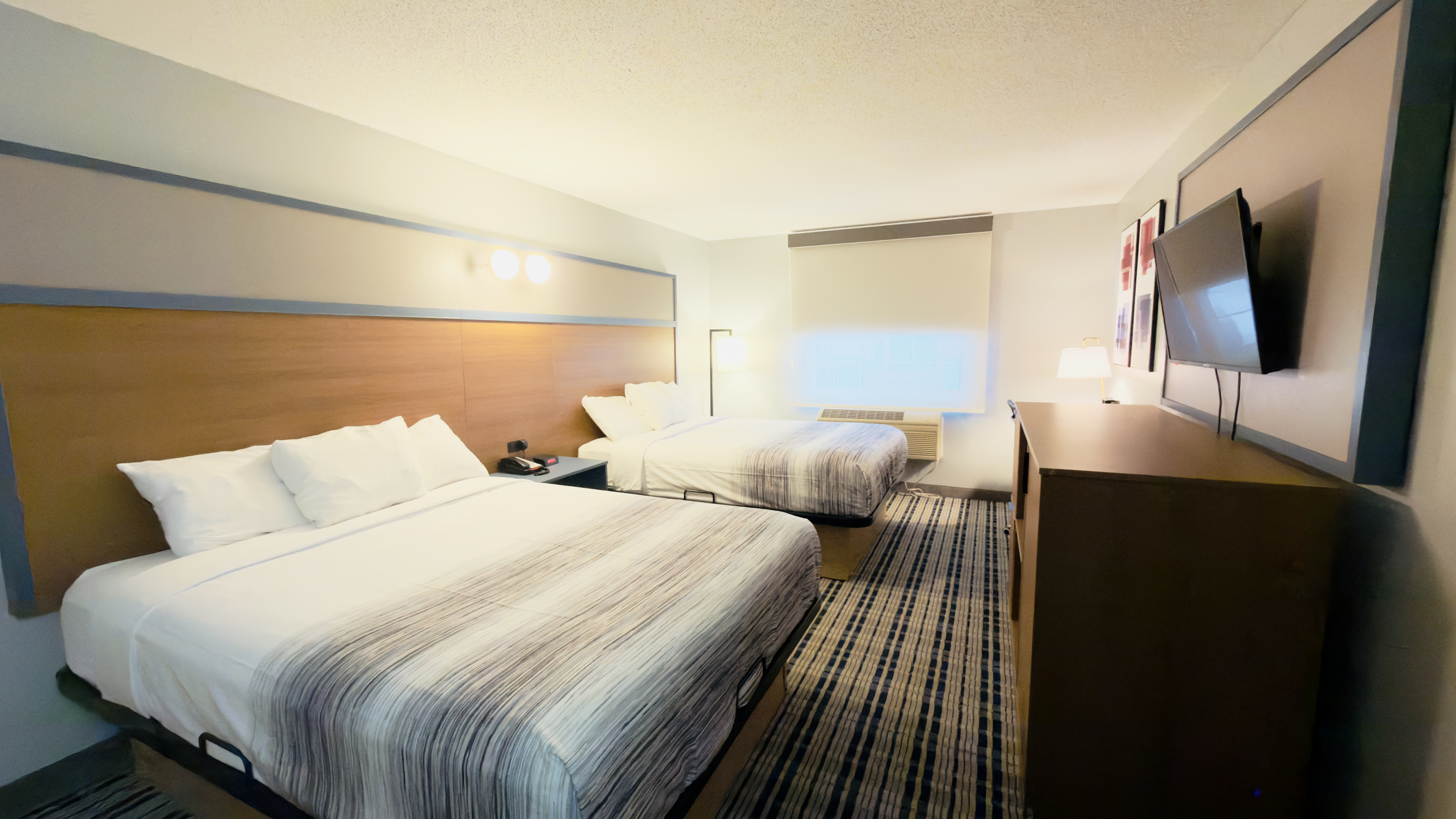 Guest room at the AmericInn by Wyndham Lake Mills in Lake Mills, Wisconsin